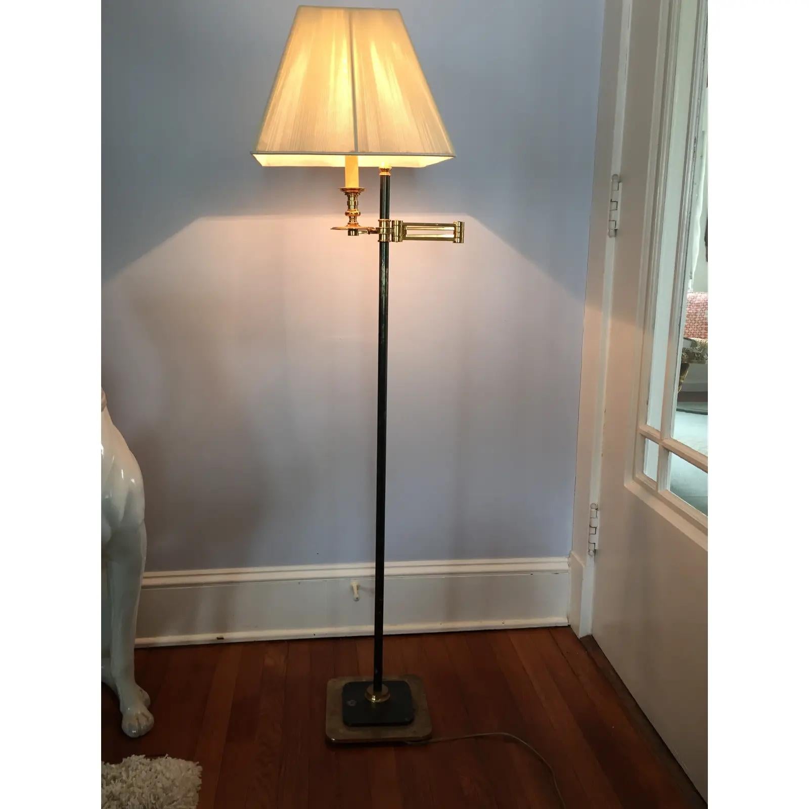 Exceptional Brass Floor lamp. Multi-directional swing arm and decorative finials. This lamp is heavy with black metal base and main tube and brass. Beautifully designed - solid with tight movements. Classy! See pics for condition. Functionally is