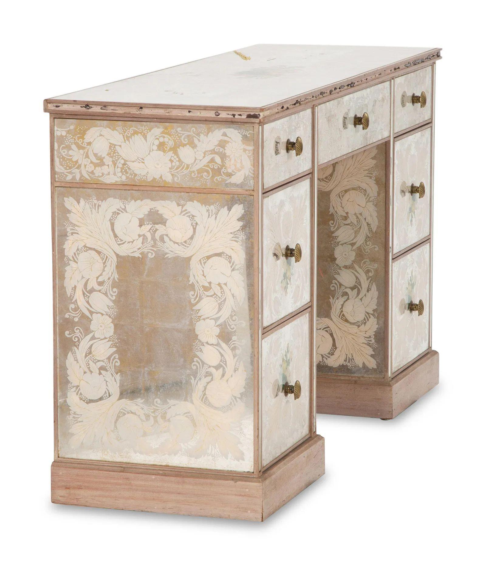 Hollywood Regency French Eglomise mirrored desk, Vanity or writing table.
A stunning Eglomise knee hold desk having all over decorative design on a painted distressed base. 
Height 31 x width 48 x depth 16 1/2 inches.