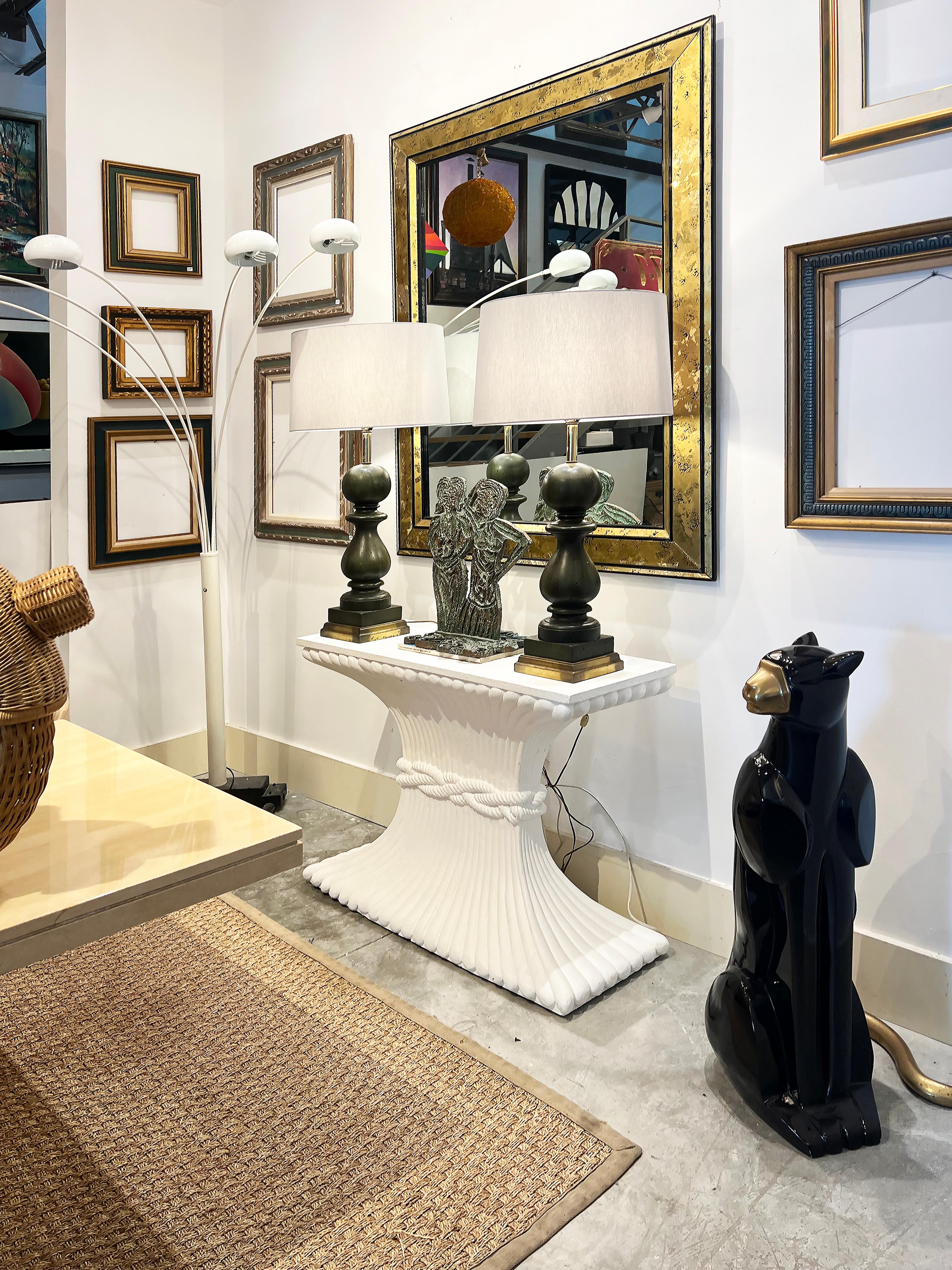 Hollywood Regency Gesso Carved Wood Console Table, Wheat Sheaf Form 

Offered for sale is an elegant vintage Hollywood Regency carved wood sheaf of wheat-form console table finished in white matte gesso. The table is carved and finished on all sides