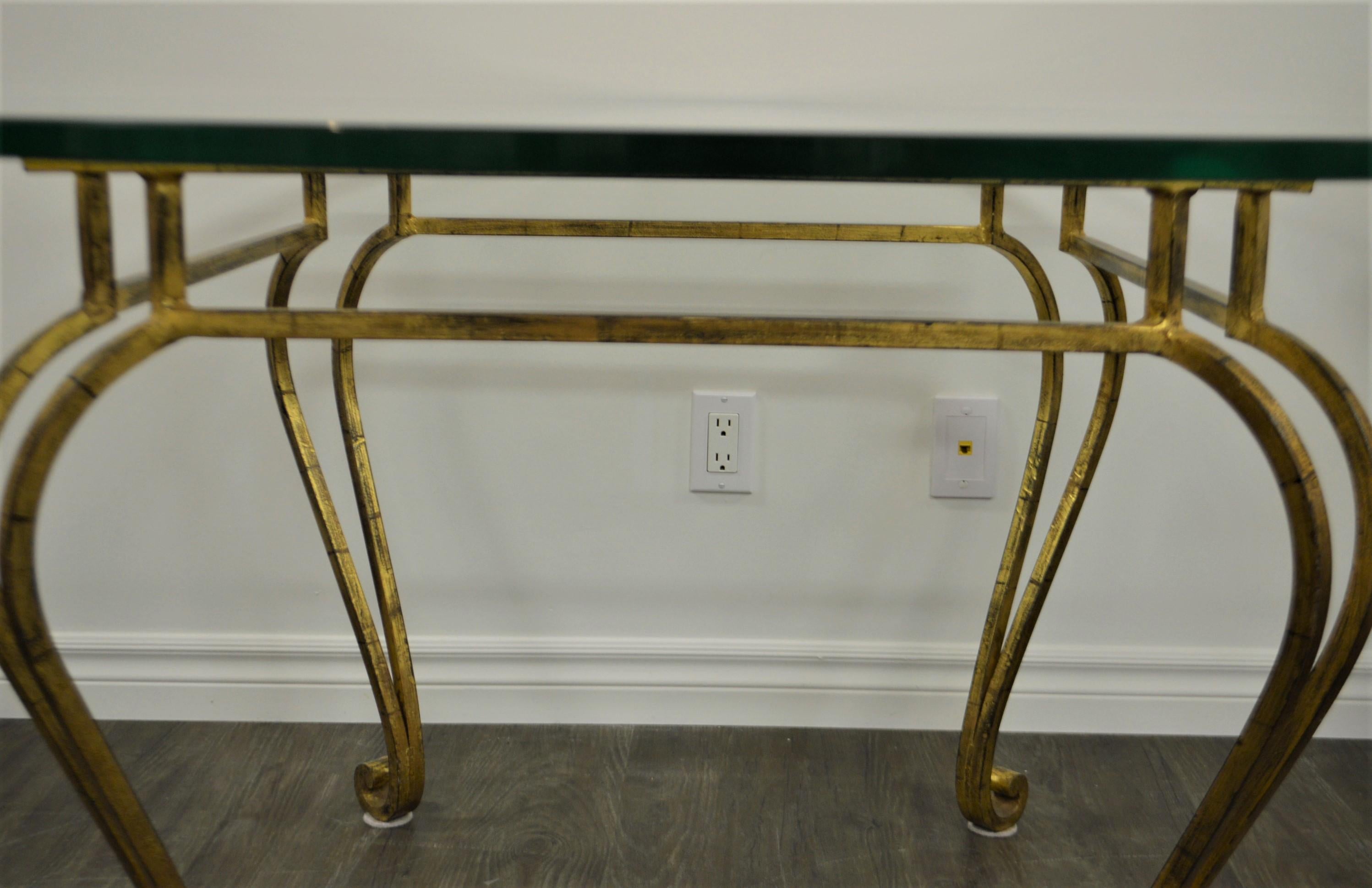 Hollywood Regency wrought iron gilded center table or breakfast, dining table.
Legs are of Louis XV style the table is very solid. The glass top is 3/4