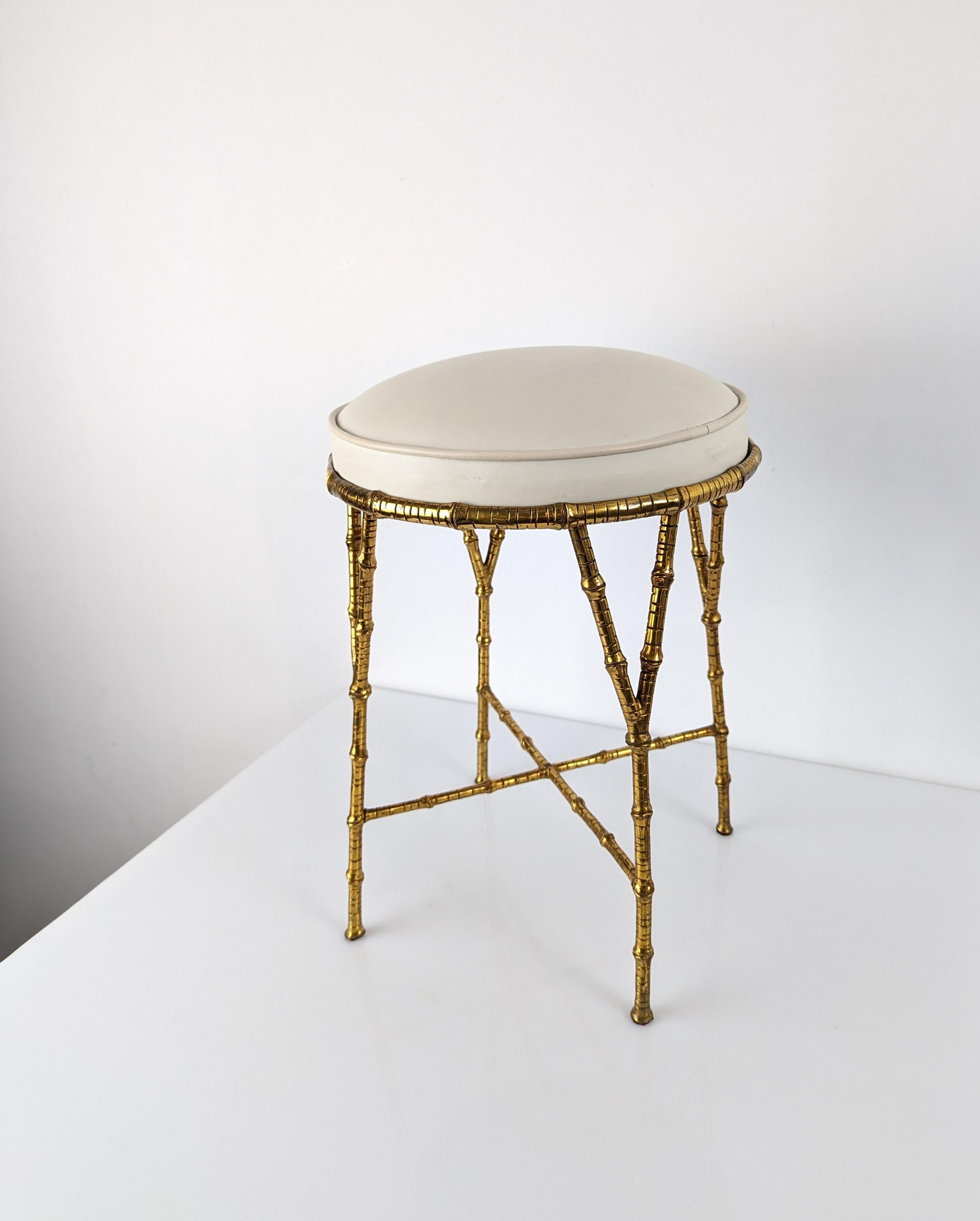 Elegant and exclusive stool made of a precious brass bamboo attributed to the style and quality of the best Maison Bagues designs. A super decorative piece that accompanies and enhances any room.