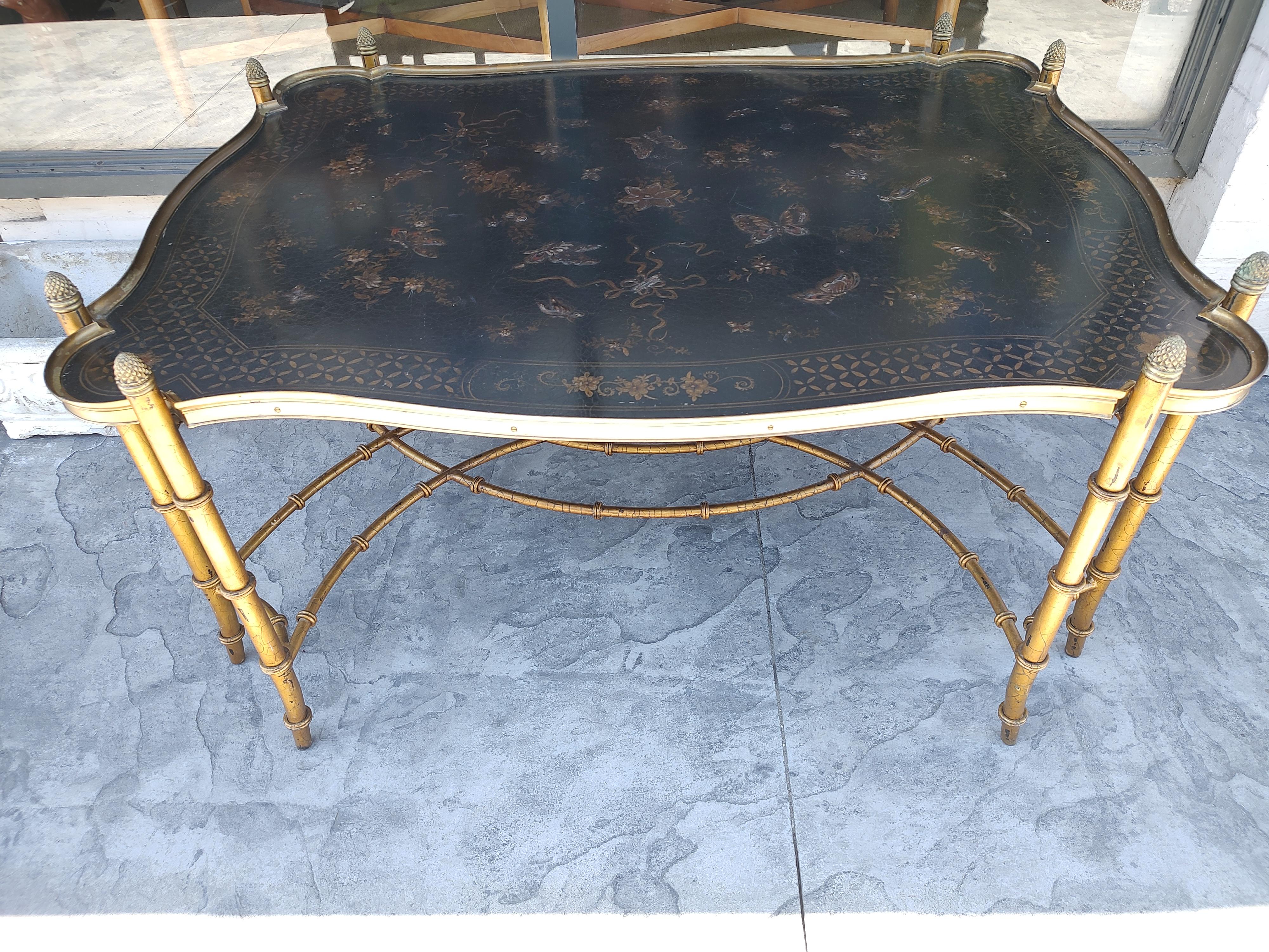 Fabulous and high quality design with embossed tray style top. Butterflies and birds dominate the top in a joyful display of nature. Brass frame with gilt iron legs. Aged to perfection. Well cared for. In excellent vintage condition with minimal