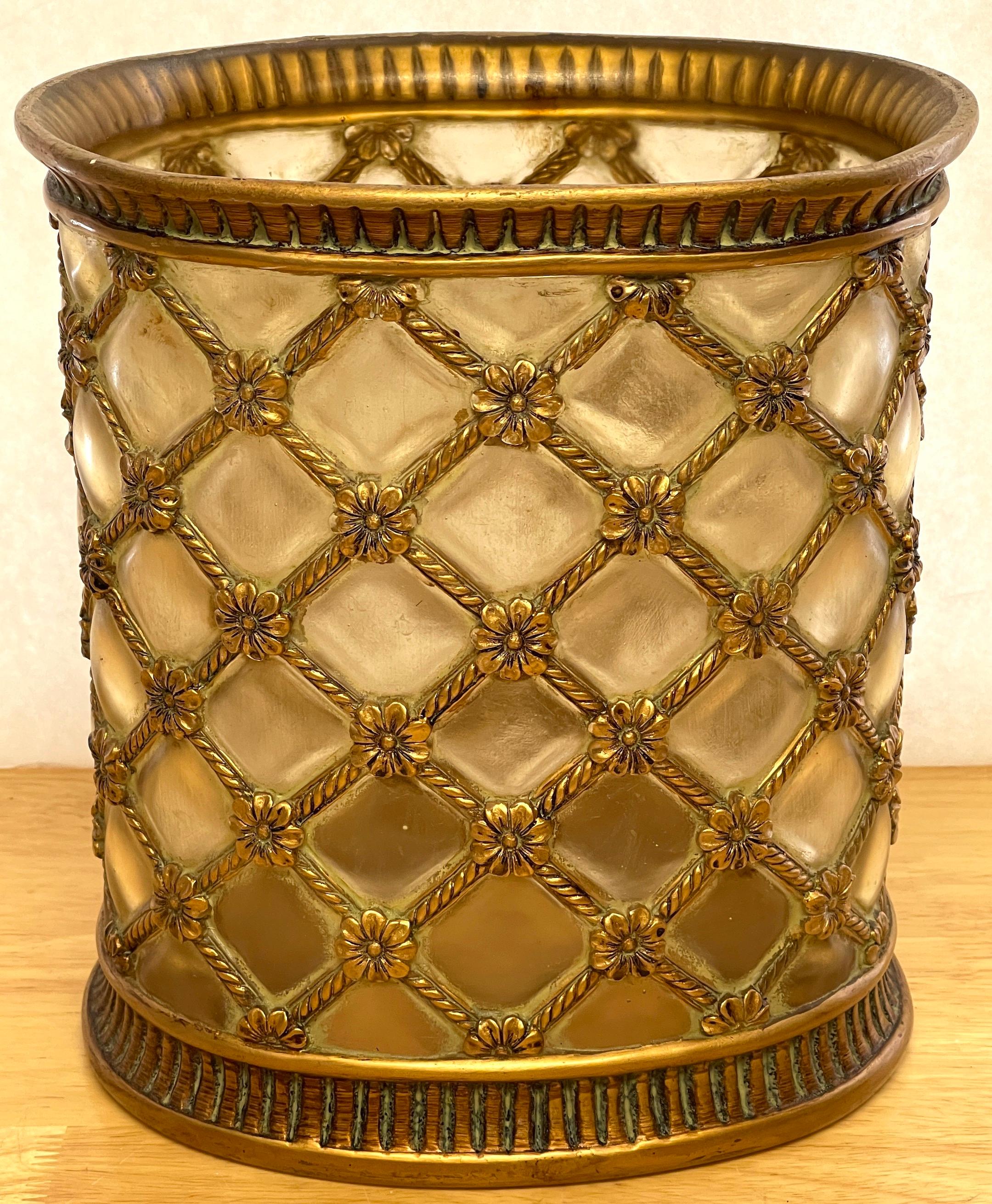 Hollywood Regency gilt & frosted lucite wastepaper basket/ trash can
A unique glamorous wastepaper basket/ trash can, of oval form with a gilt reeded top, the middle with continuous 'blown-out' / convex frosted /'cushions', joined by gilt woven