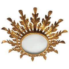 Hollywood Regency Gilt Iron Leafed Sunburst Light Fixture with Frosted Glass
