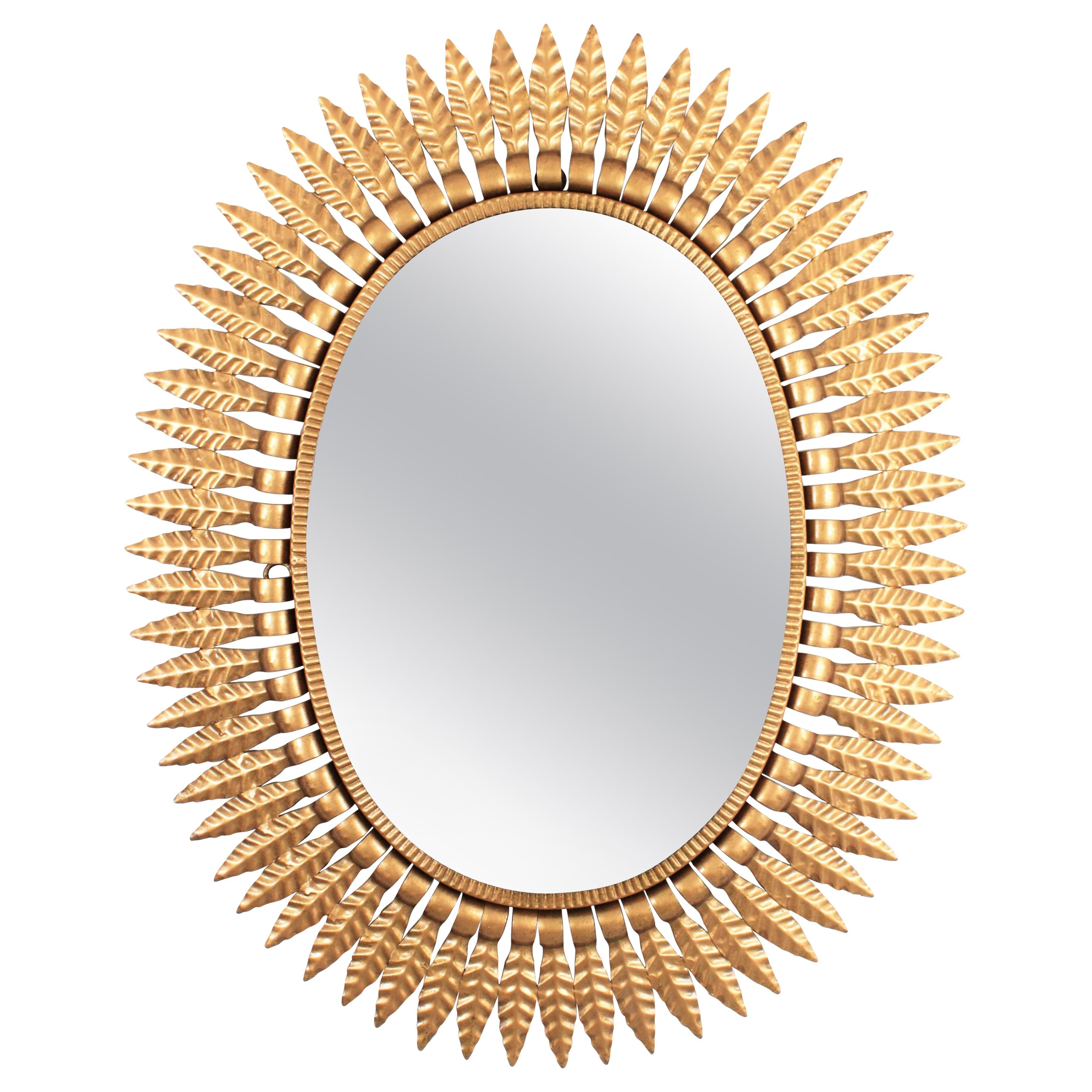 Hollywood Regency Gilt Metal Oval Sunburst Mirror, Spain, 1950s