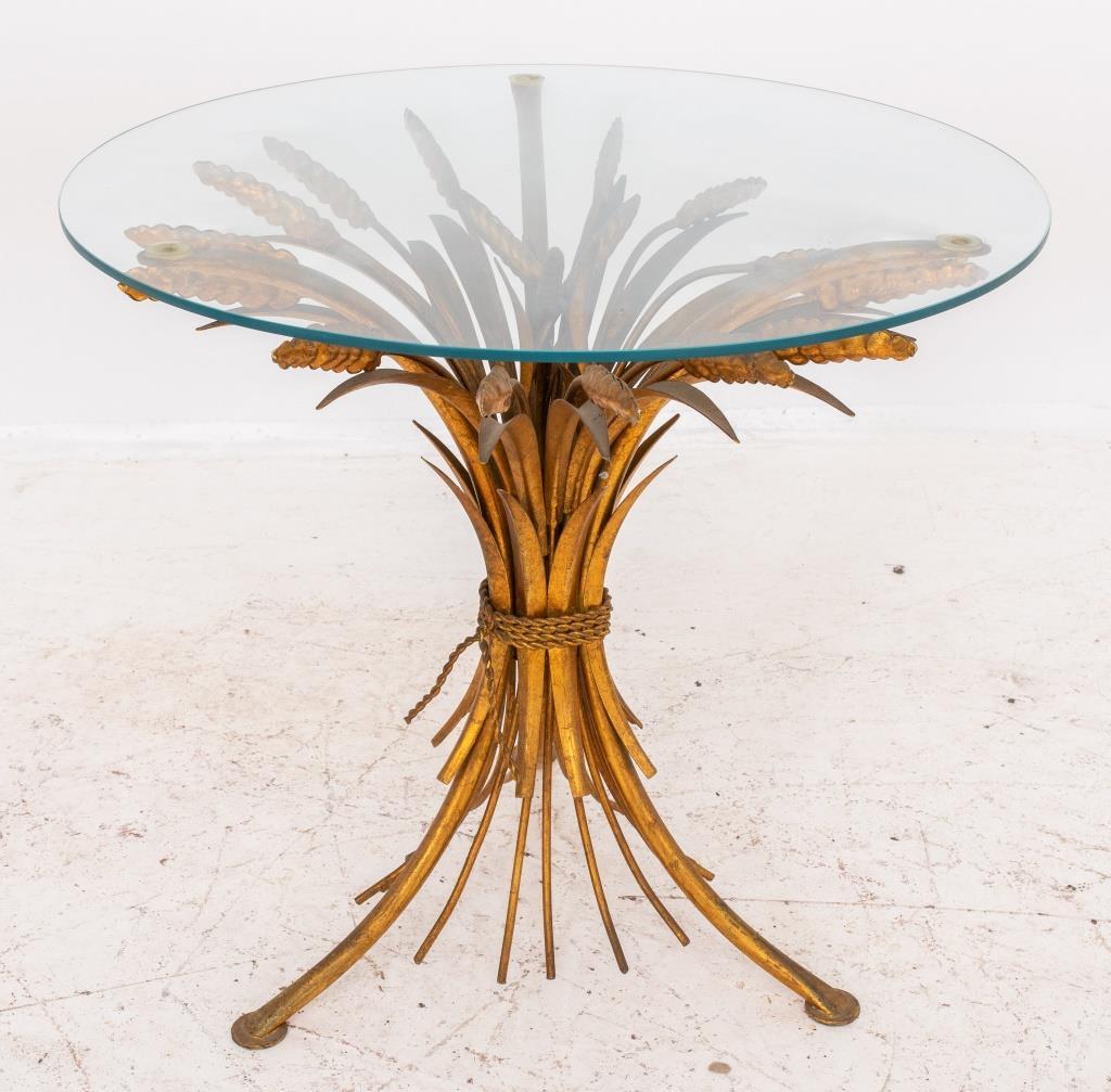 Hollywood Regency midcentury modern Italian gilt metal wheat sheaf side table with circular glass top, ca. 1950s, after the model popularized by Coco Chanel at the rue de Cambon.  

Dealer: S138XX