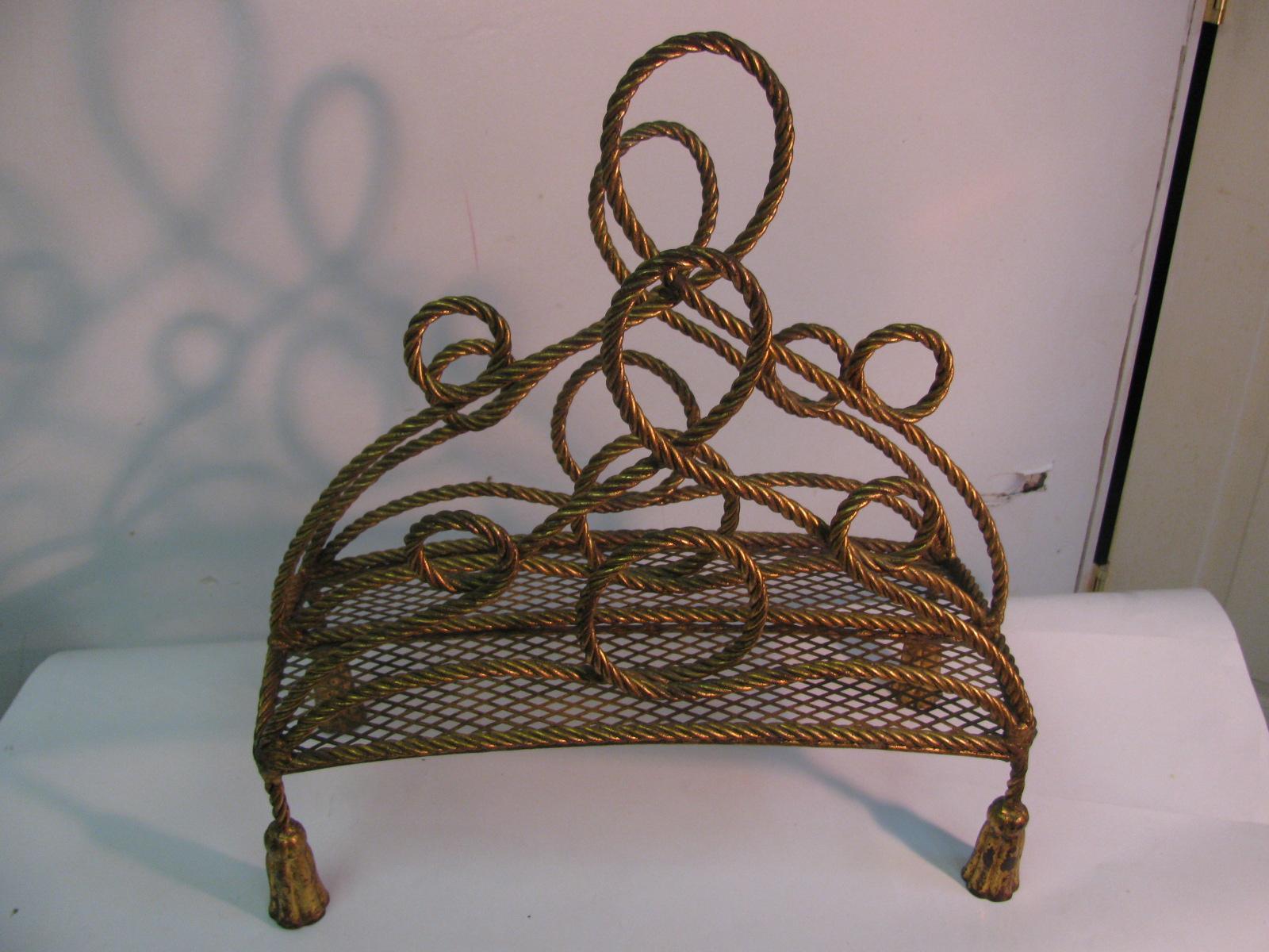 Fabulous gilt rope and tassel magazine rack which is made in Italy. Sits flush on the floor and is very sturdy. This item can be parcel posted.