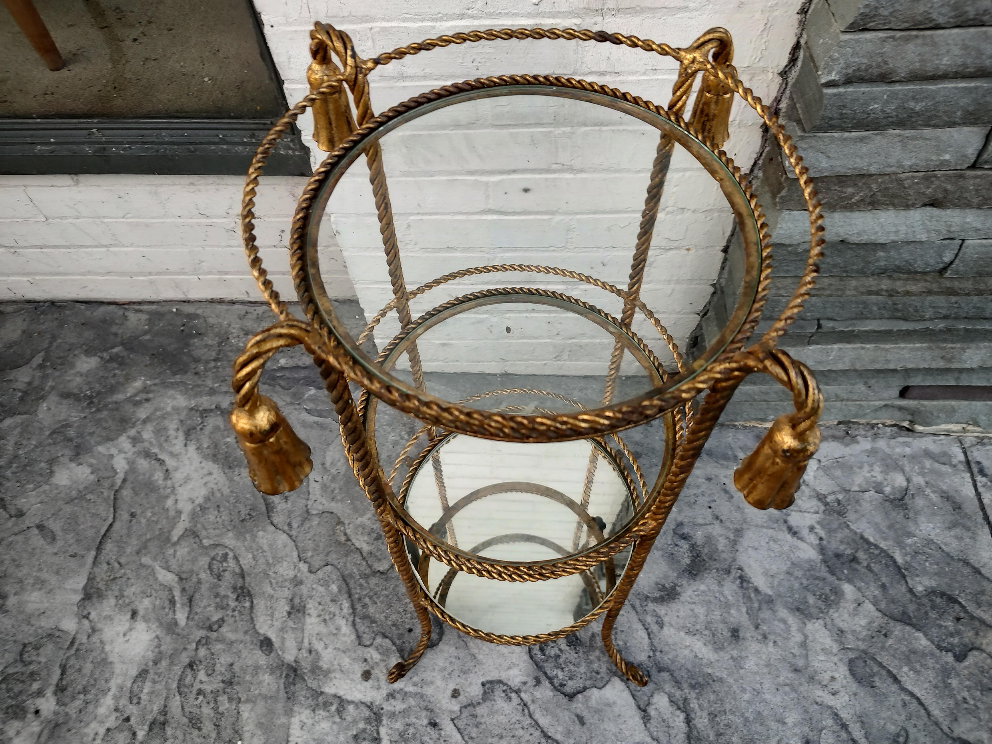 Fabulous 3 Tier shelf etagere unit in gilt Rope & tassel. Two glass shelves and one mirror, 11.5 inches in diameter. In excellent vintage condition with minimal wear. Can be parcel posted.