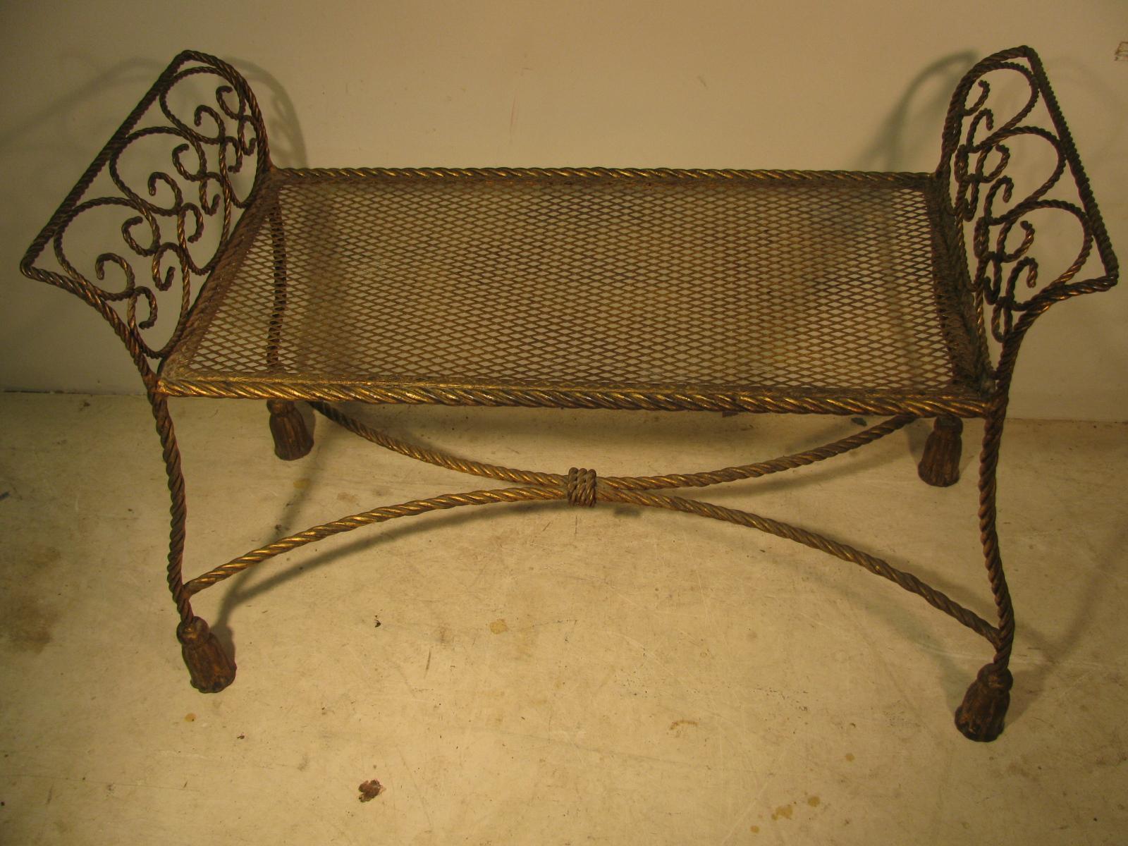 Exceptional gilt iron rope and tassel bench. Many places to use this wonderful piece, bedroom, bathroom , hallway, vanity, by a window. In excellent vintage condition with minimal wear.