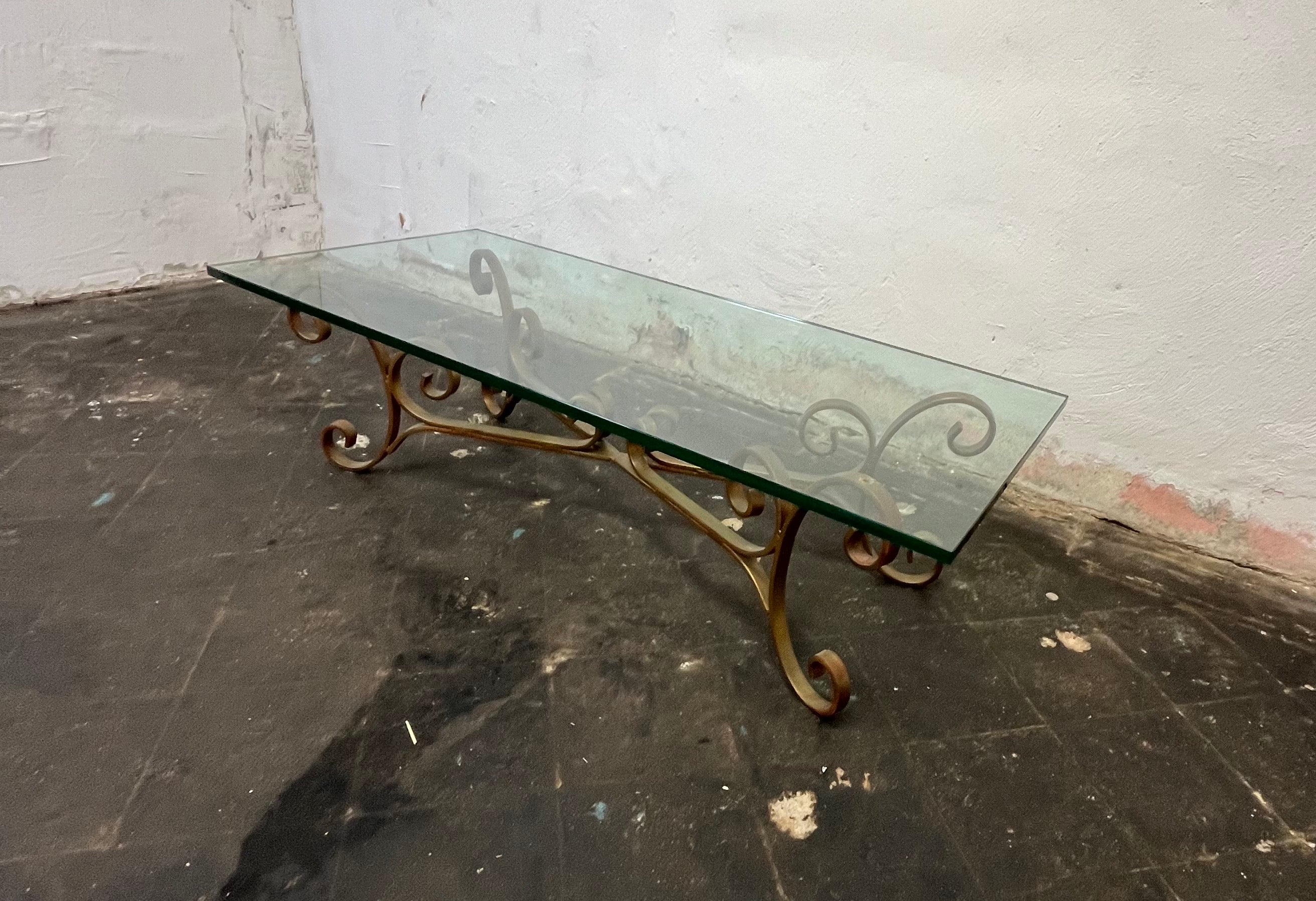 Beautiful gilded iron scroll coffee table base in Hollywood Regency style.
This piece has a wonderful distressed gold finish and is very heavy.
Gilt metal base with 3/4
