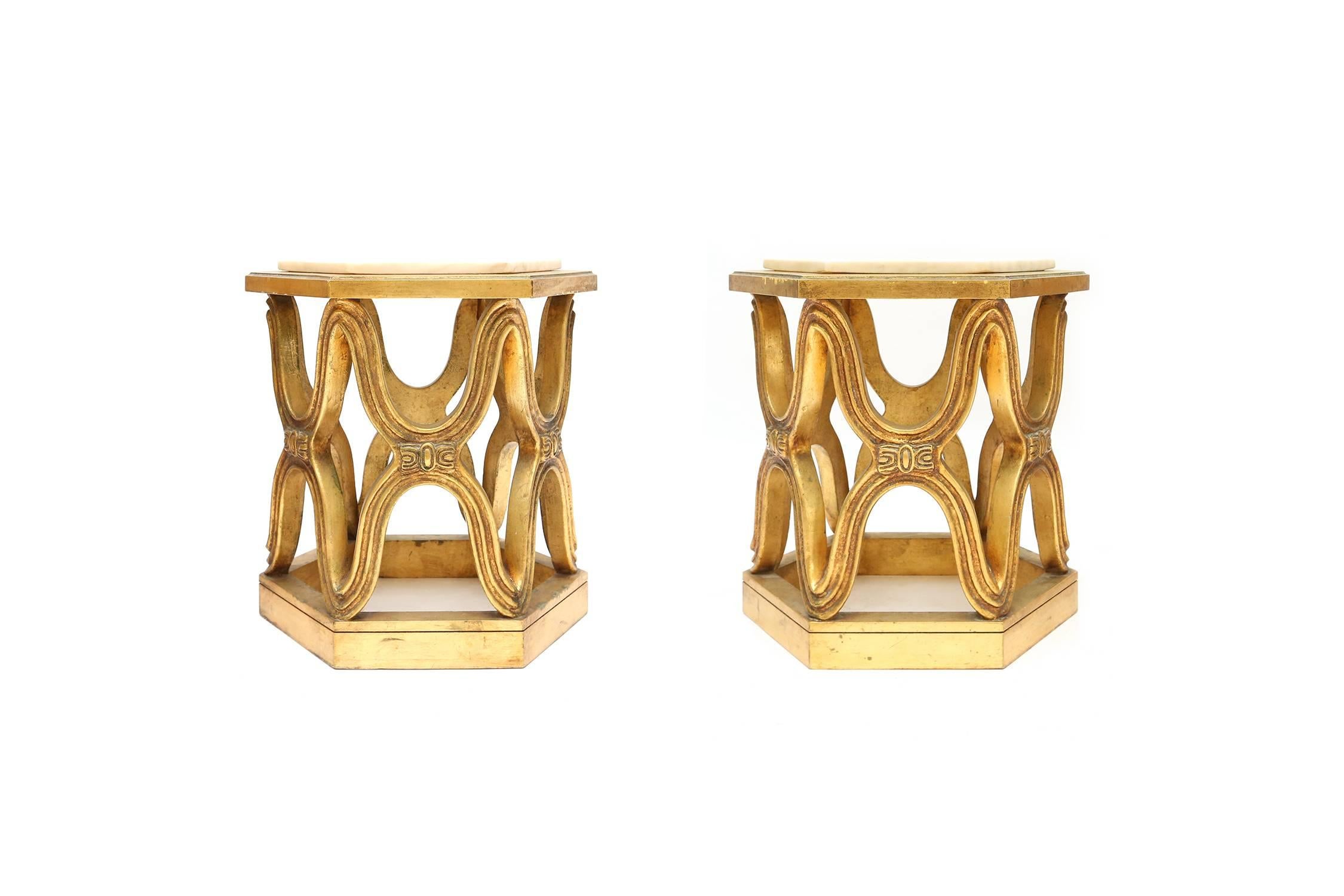 Mid-Century Modern stunning pair of giltwood side tables.
Hexagonal Calacatta marble top.

Italy, the 1940s.

Measures: Ø 42 cm, H 44 cm.