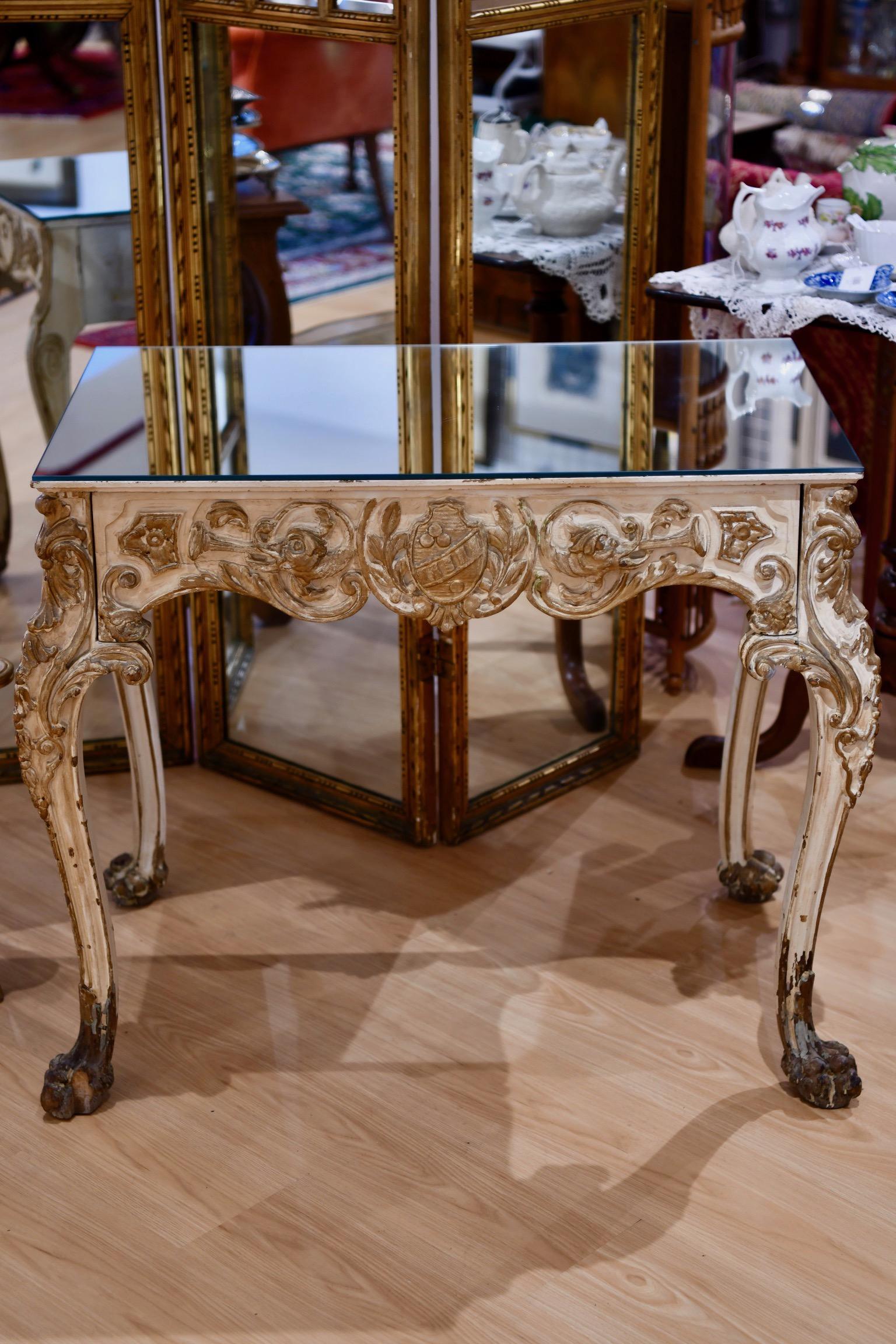 Finely carved late 19th or early 20th century Hollywood Regency white and parcel-gilt decorated vanity by Jansen, with mirrored top and a velvet-lined center drawer. Wear is consistent with age with some scratching to mirror top and gilt flaking at