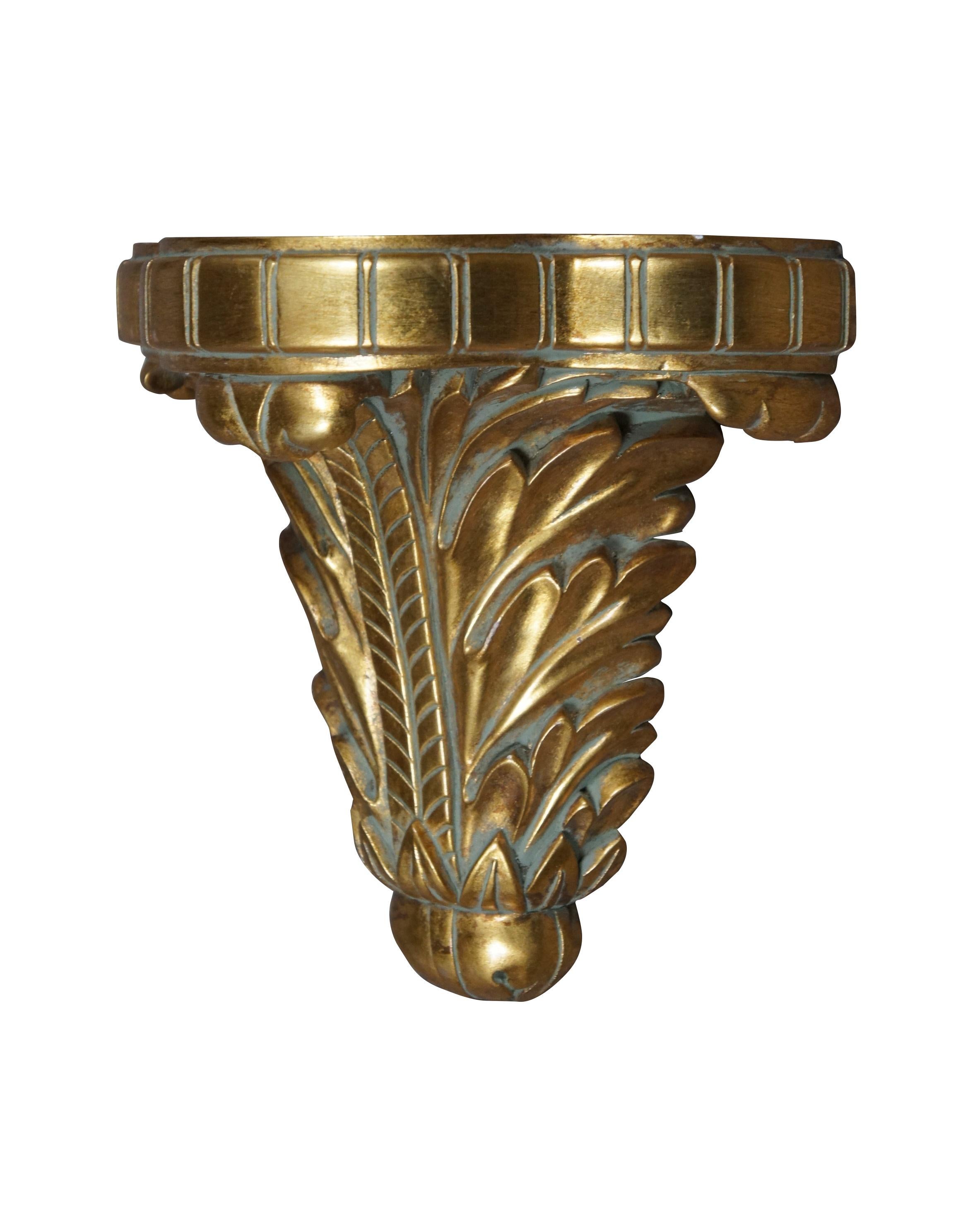 Circa mid 20th century Hollywood Regency style gilt wood wall shelf / sconce carved with acanthus leaves and a lobed demilune top.

DIMENSIONS
9.5