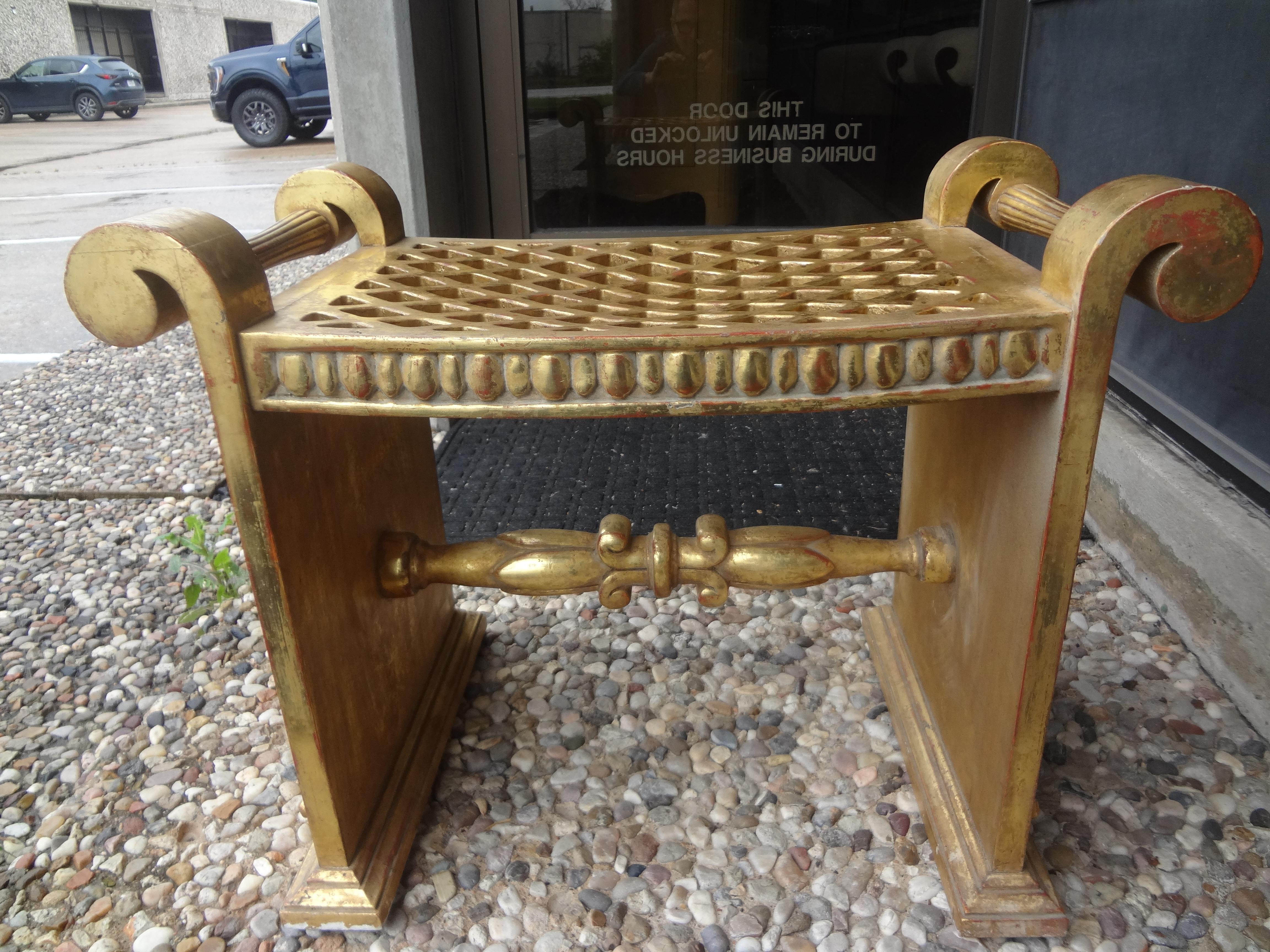 Italian Hollywood Regency giltwood bench.
This versatile midcentury gilt wood bench, stool or ottoman has beautiful gilding and a lattice work seat. Perfect as a vanity bench or wherever extra seating is needed. A cushion could be easily added if