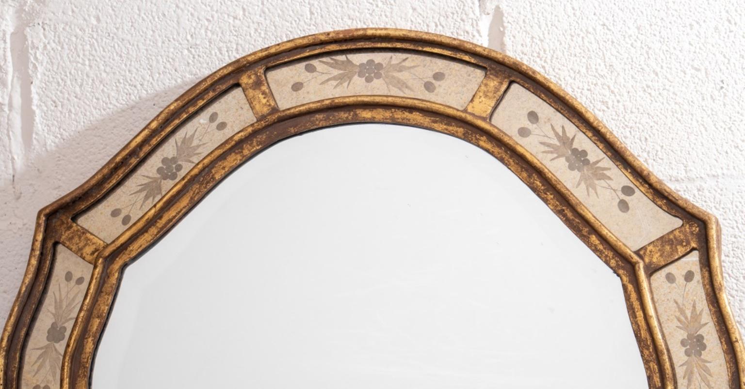 Hollywood Regency giltwood mirror, in the Venetian taste with a shaped central plate surrounded by twelve conforming small floral etched plates. Measures : 35