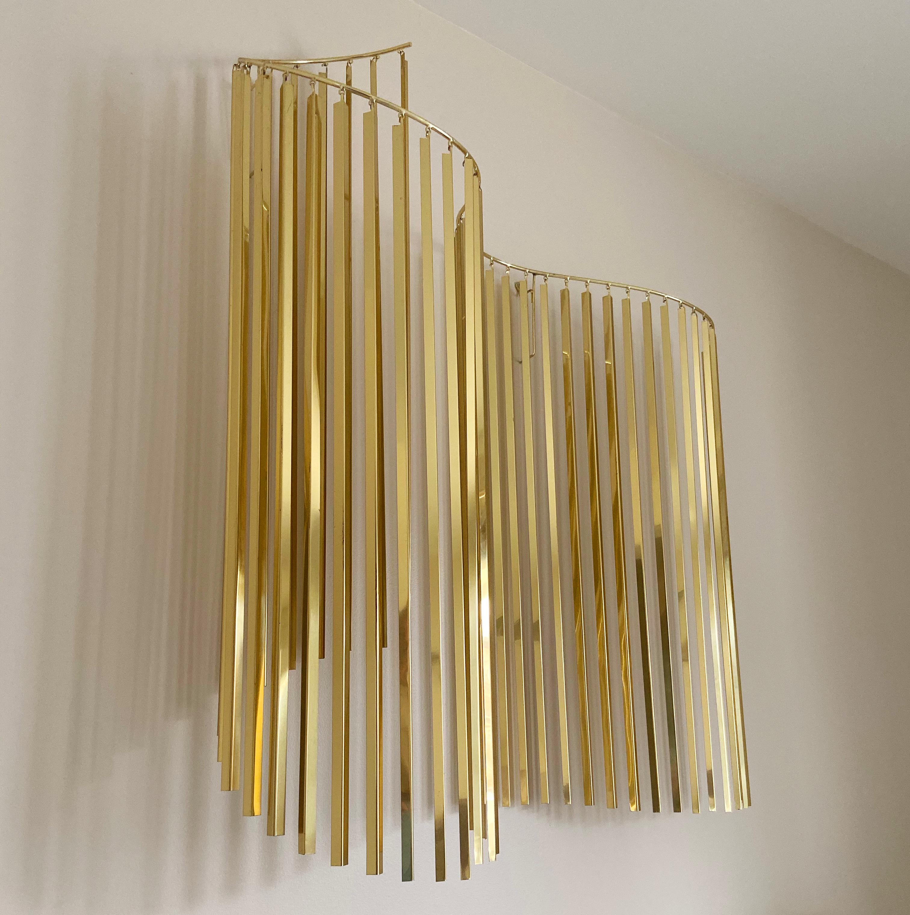 An incredibly cool piece designed by Curtis Jere and produced by Artisan House in the 1980s. It consists of a wave form frame with many brass hanging rods. Signed and dated by the artist.