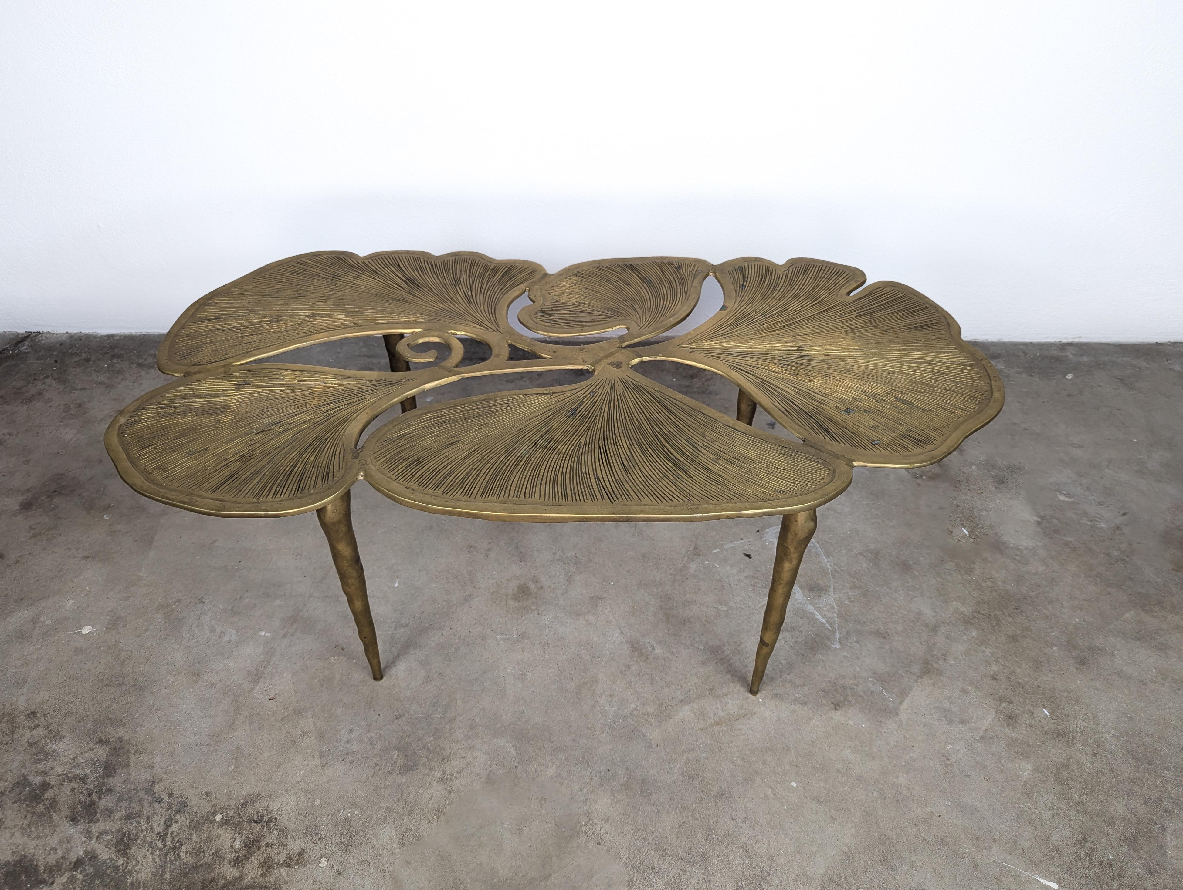 Introducing our exquisite Sculptural Organic Brass Ginkgo Leaf Coffee Table, a stunning piece that brings an unparalleled sense of sophistication and elegance to any living space. This unique coffee table features intricate sculptural detail with a