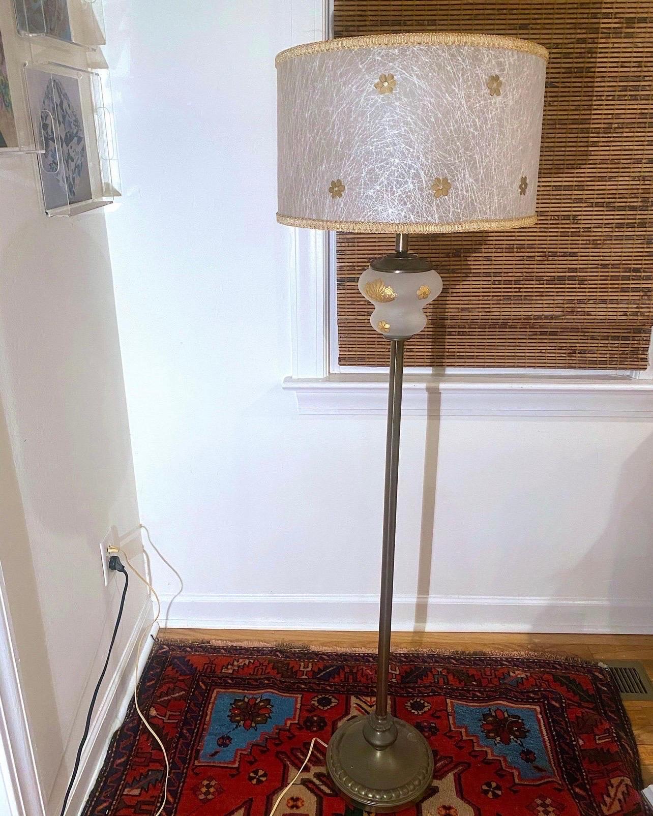 Vintage Hollywood Regency Rembrandt Torchiere Lamp With Original Fiberglass Shade and milk glass diffuser. But on to this fabulous lamp: a brass base with a frosted clear glass at the neck with gold daisies painted. The original waffle milk glass