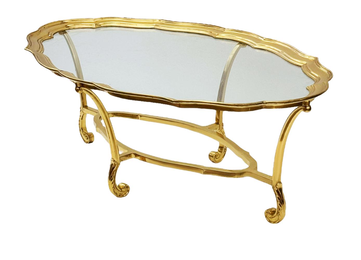 A high quality and elegant design made by LaBarge in France in the 1980s. It features heavy solid brass construction with inlayed clear glass top.