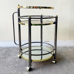 Hollywood Regency Gold and Charcoal Three Tear Mirrored Swivel Top Beverage Cart