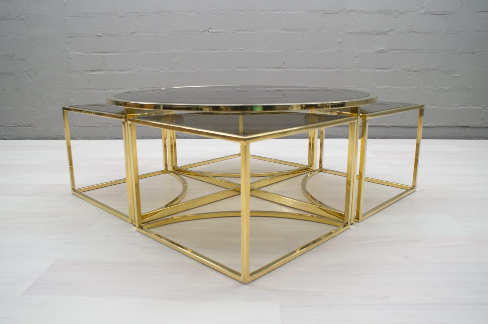 A very decorative coffee table with four side tables that can be placed underneath. 

Elegant and noble looking. 

Many different positions possible. See pictures. 

Very good condition with light wear consistent with age and use.