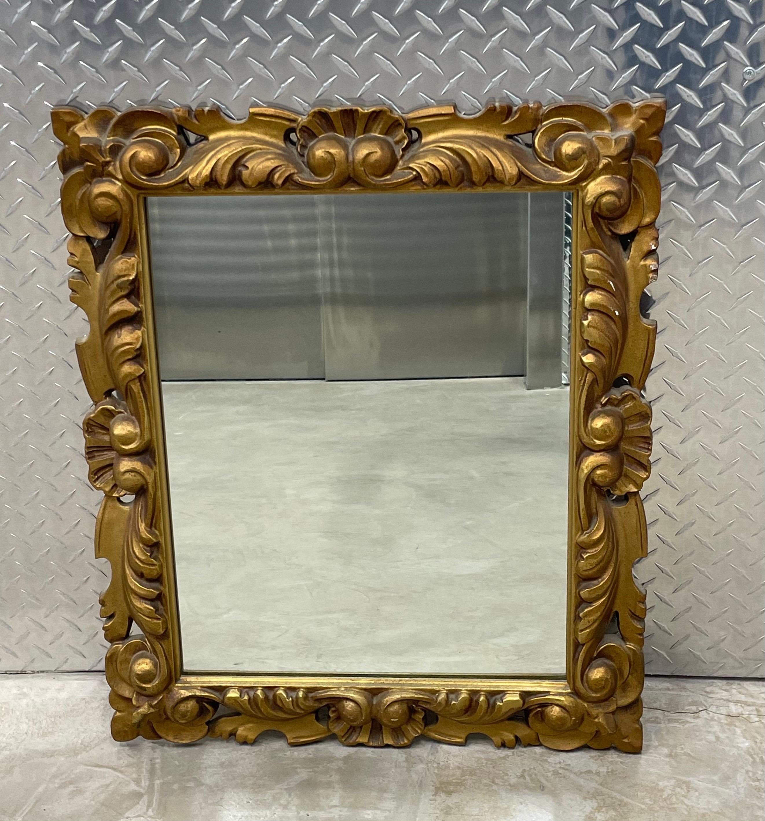 Hollywood Regency gold decorative mirror, floral leaf pattern.
