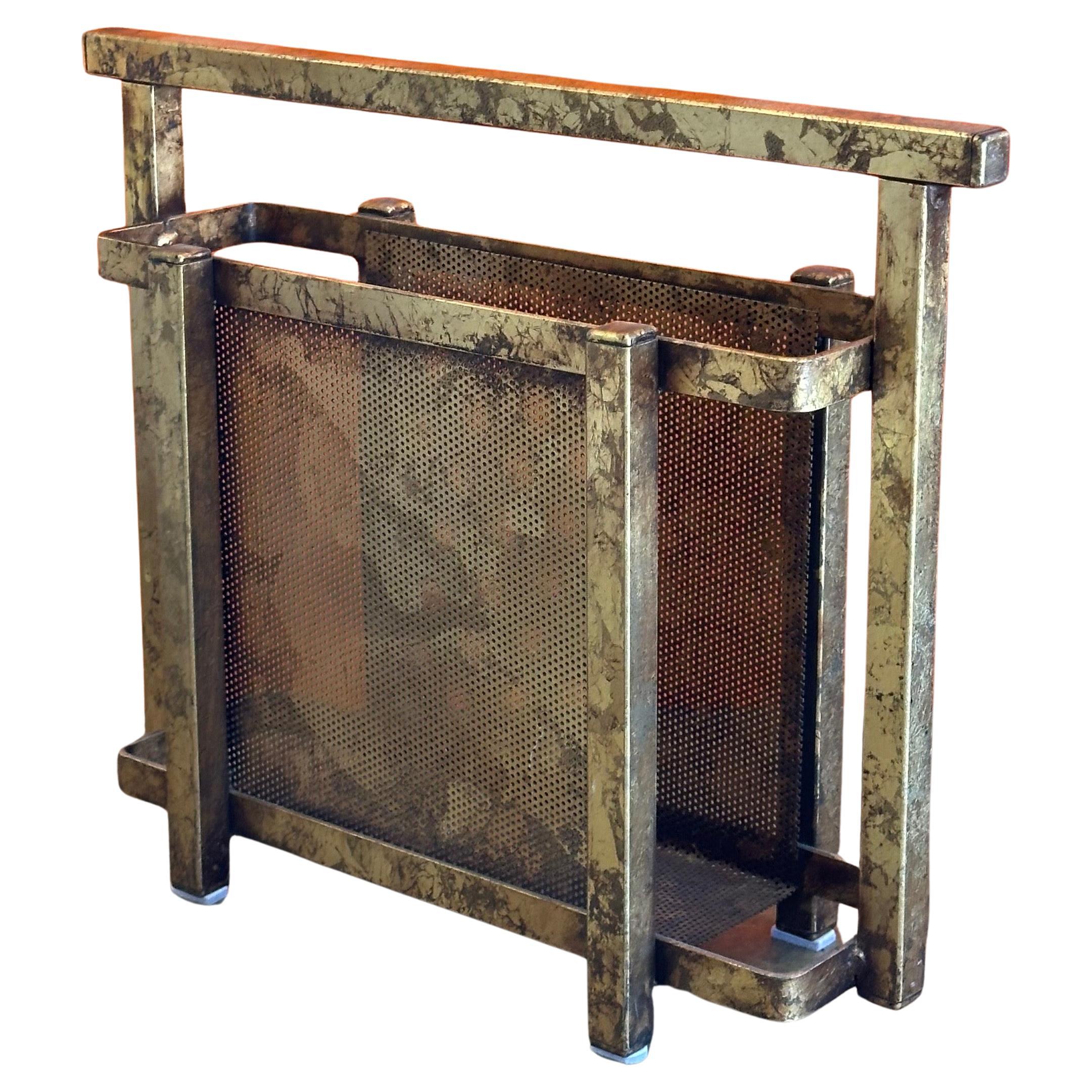 Hollywood Regency gold gilt Italian magazine holder, circa 1960s. The piece is in very good vintage condition with a wonderful patina and measures 17.25