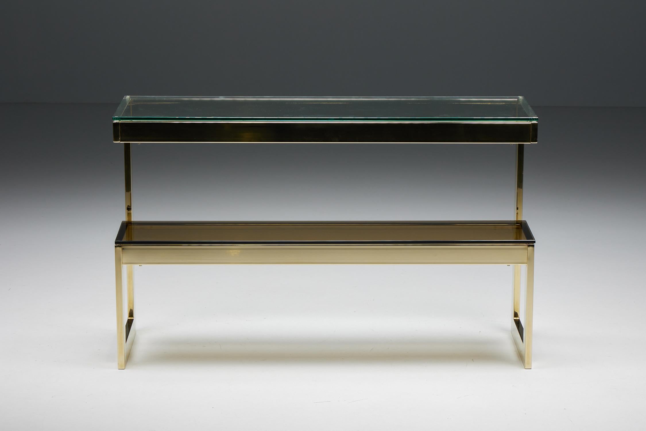 Hollywood Regency; Console table; Belgo Chrome; Belgian design; Maison Jansen; 

Hollywood Regency console table, manufactured in the 1980s by Belgo Chrome and attributed to Maison Jansen. This 24-karat gold layered two-tier side table is in