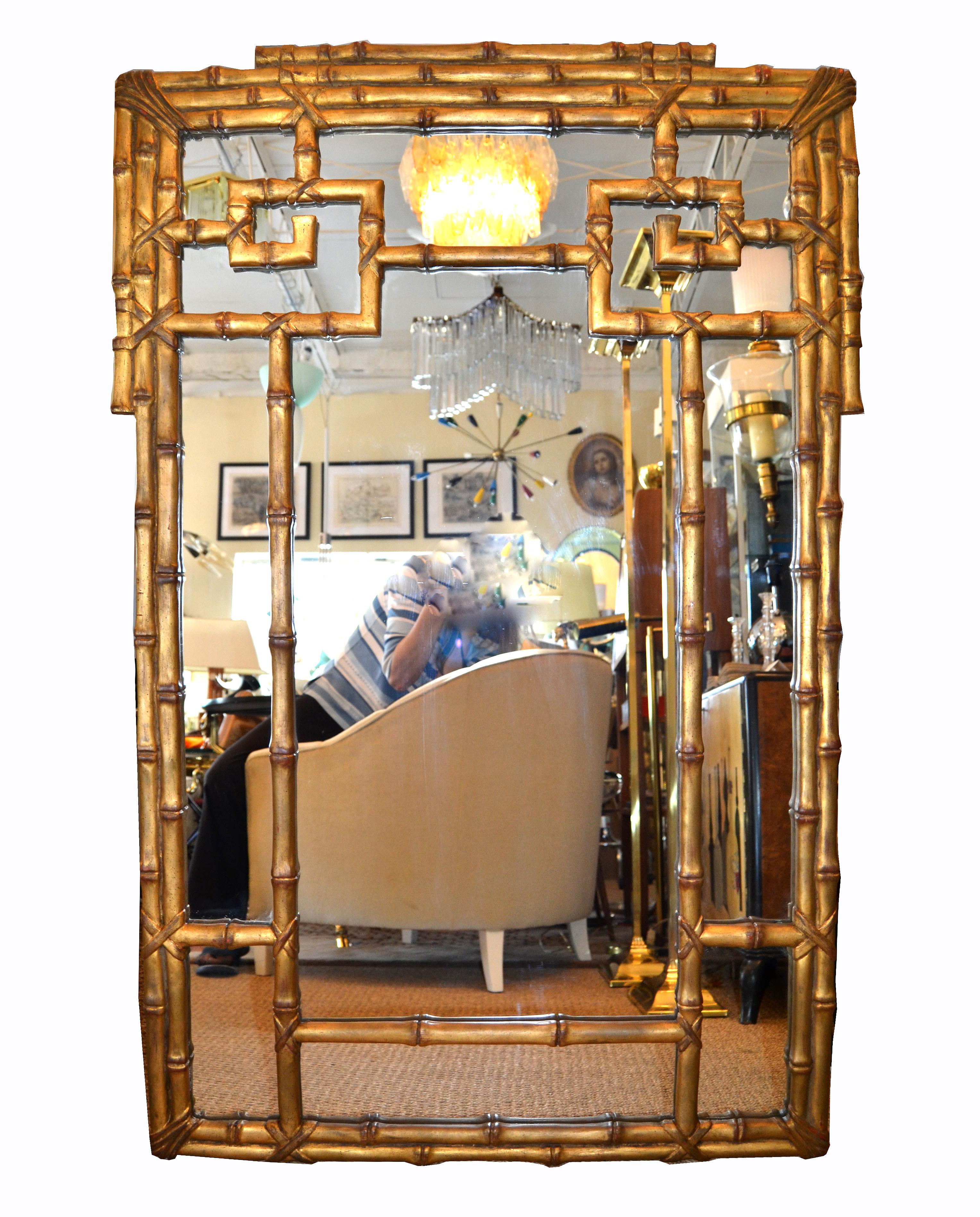 Hollywood Regency gold leaf faux bamboo Greek key wall mirror.
Can only be hung vertical.
 