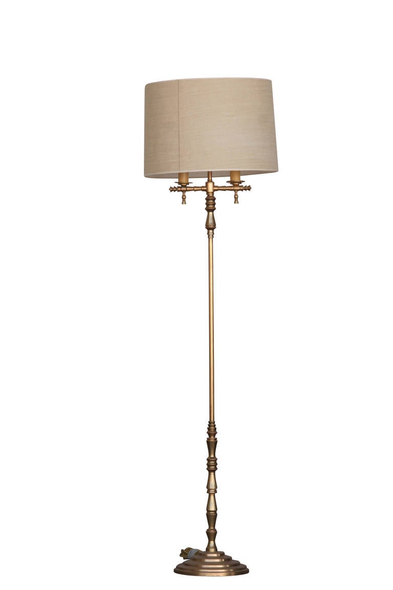 Hollywood Regency gold-plated bronze lamp with heavy Art Deco influence accents. Like the stars and furniture designers in Hollywood during the 1930s, this lamp brings the glamour and glitz in a big way. 

From it's stepped Art Deco influence base