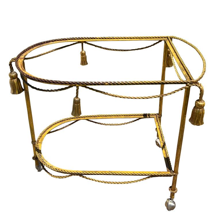 Hollywood Regency Gold Tassel Motif Rolling Bar Cart with Double Glass Shelves In Good Condition For Sale In Oklahoma City, OK
