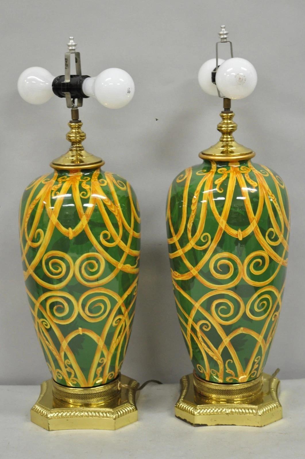 Contemporary Hollywood Regency Style Green & Gold Scroll Painted Ceramic Table Lamps - a Pair. Circa Late 20th Century. Measurements: 24