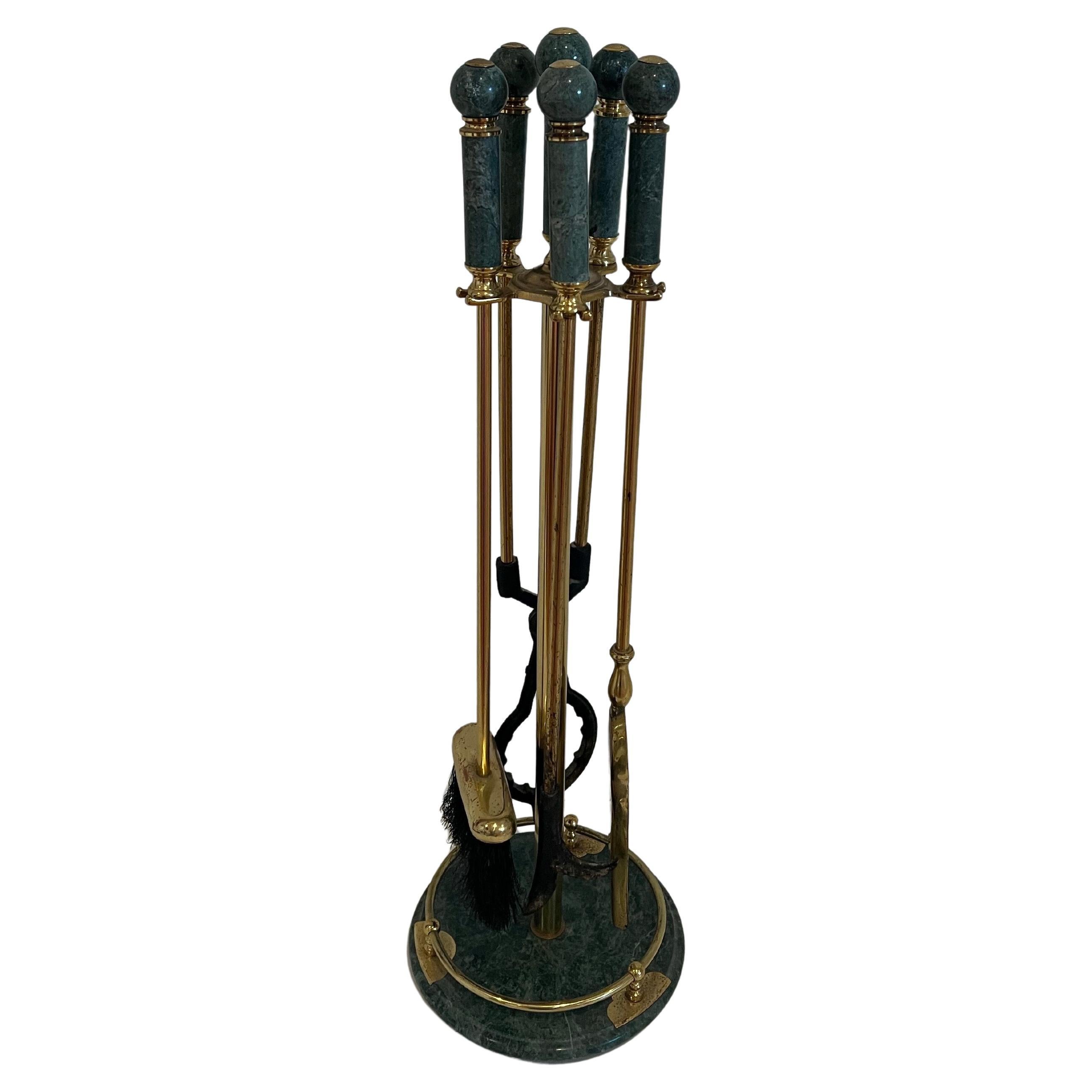 Elegant brass fireplace tool set with green marble base and handles, circa 1970s. Amazing quality; very heavy with nice detail on the handles. Set includes a shovel, brush, poker and log holder.