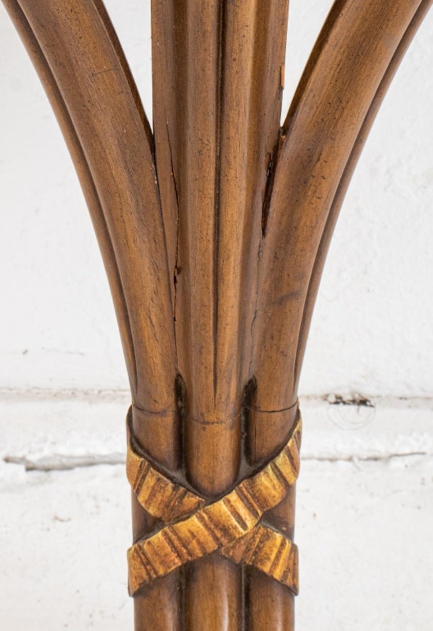 Hollywood Regency Grosfeld House attributed Prince of Wales feather console, with shaped rectangular walnut top above a fluted apron frieze supported by three carved plumes, ribbon-tied and terminating in a block pedestal base. Measures: 31.5
