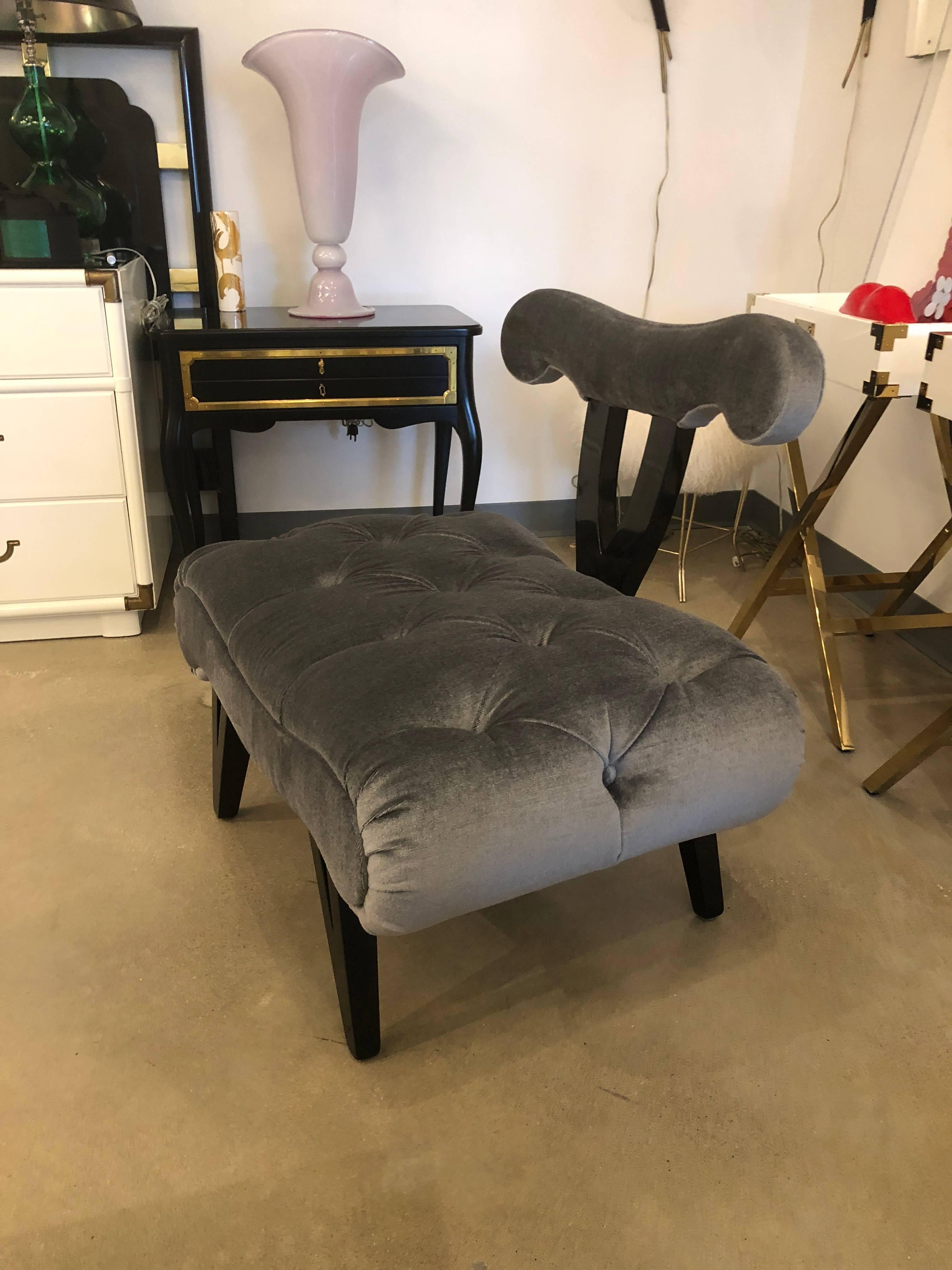 Offered is a Hollywood Regency Mid-Century Modern Grosfeld House refurbished slipper chair in ebonized wood and a shimmering gray tufted mohair velvet. Would look fabulous with an offered pair of Grosfeld House lacquered in white with brass hardware