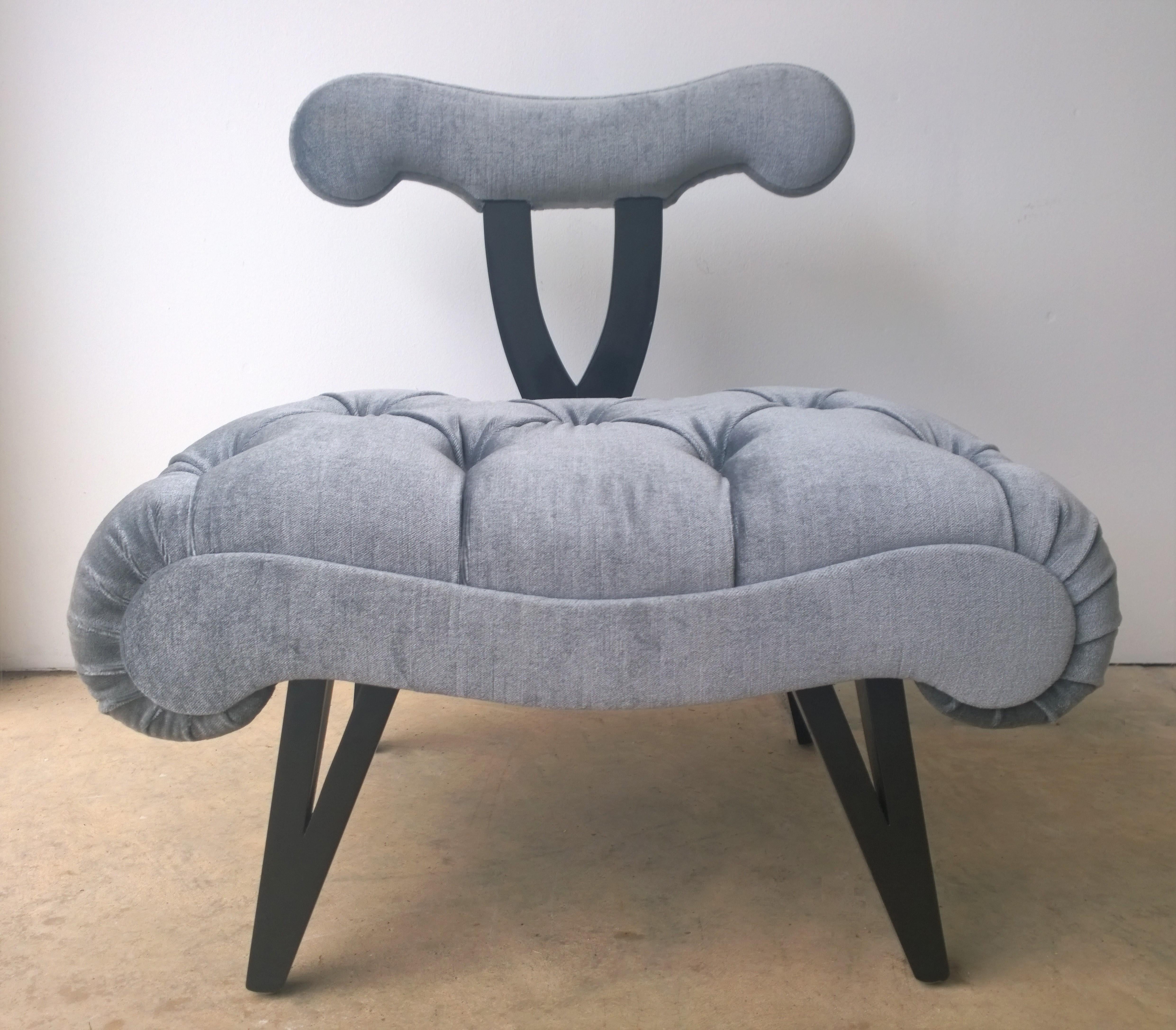 Offered is a Hollywood Regency Mid-Century Modern Grosfeld House what appears to be a refurbished slipper chair in ebonized wood and a shimmering gray tufted mohair velvet. Would look fabulous with an offered pair of Grosfeld House lacquered in