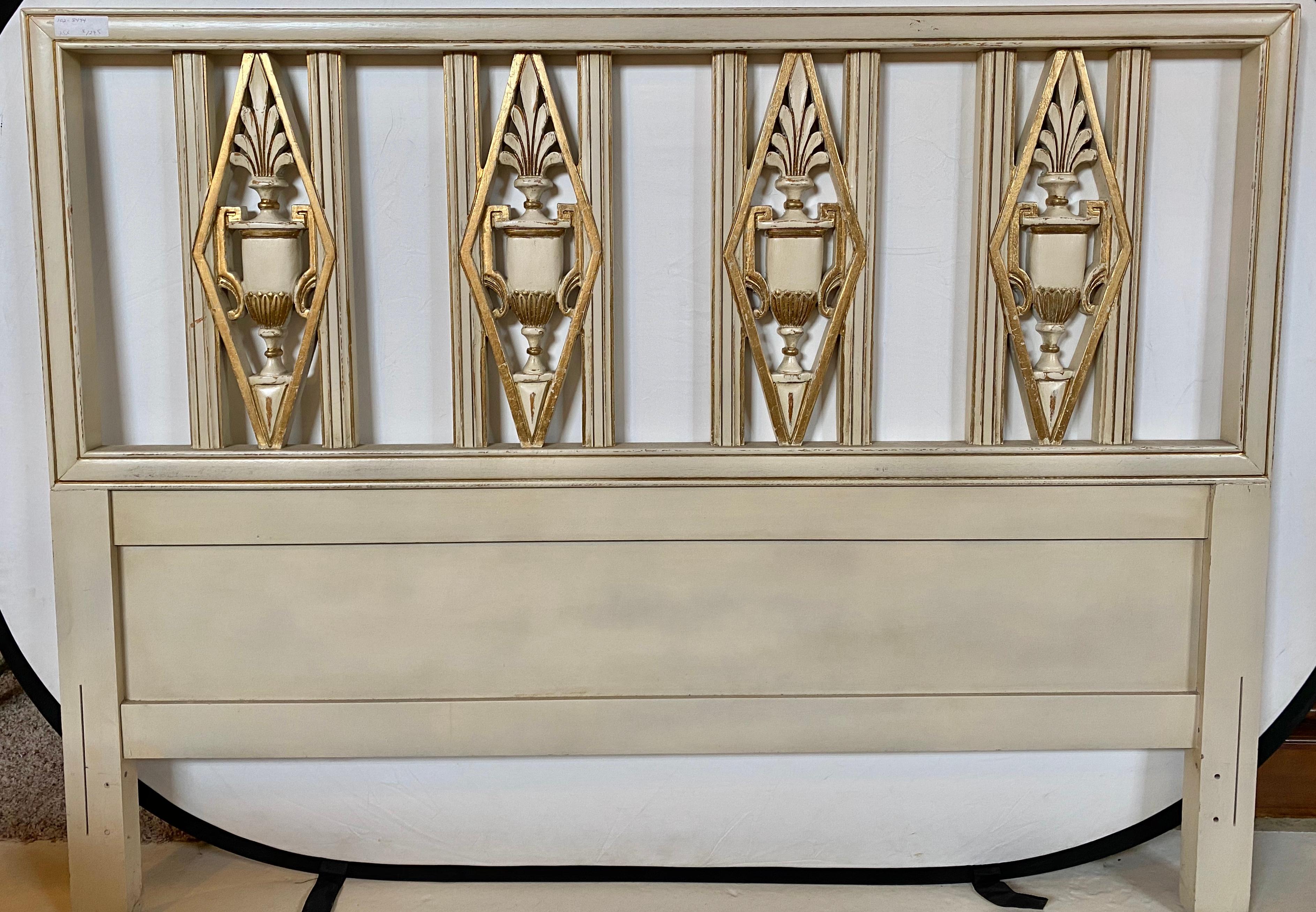 Hollywood Regency headboard. Queen size bed having gilt and paint decorated design with urn form carvings. This finely carved and painted Queen size or full sized headboard will easily fit on any metal frame it is attached to. The whole done in a