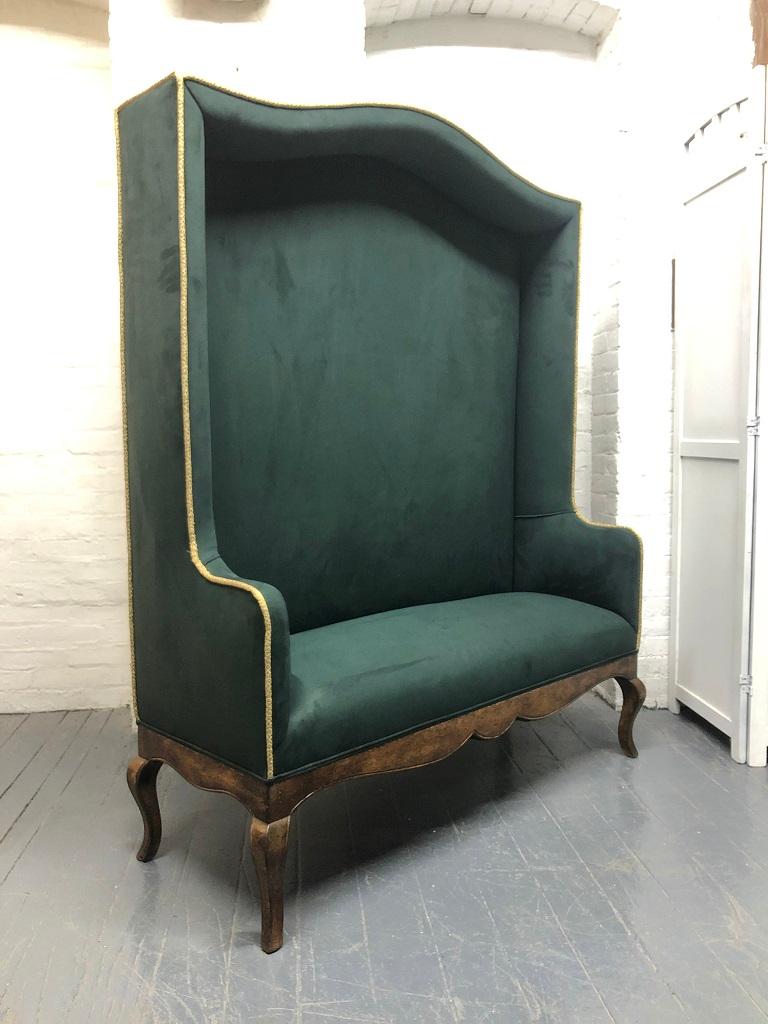 Hollywood Regency high / tall back bench. The bench has a green ultra-suede upholstery with gold embroidered trim and a hardwood base. 
Measures: 63.5 H x 50 W x 19 D. Seat depth 14 D. Set height 18.