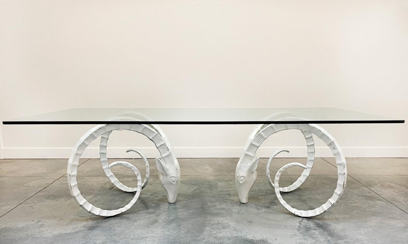 Iconic and stunning, this pair of metal Ibex Ram head dining table bases in the style of Chervet make a bold statement. The bases are Painted White and retain their original patina and could be easily painted or lacquered again. These bases will