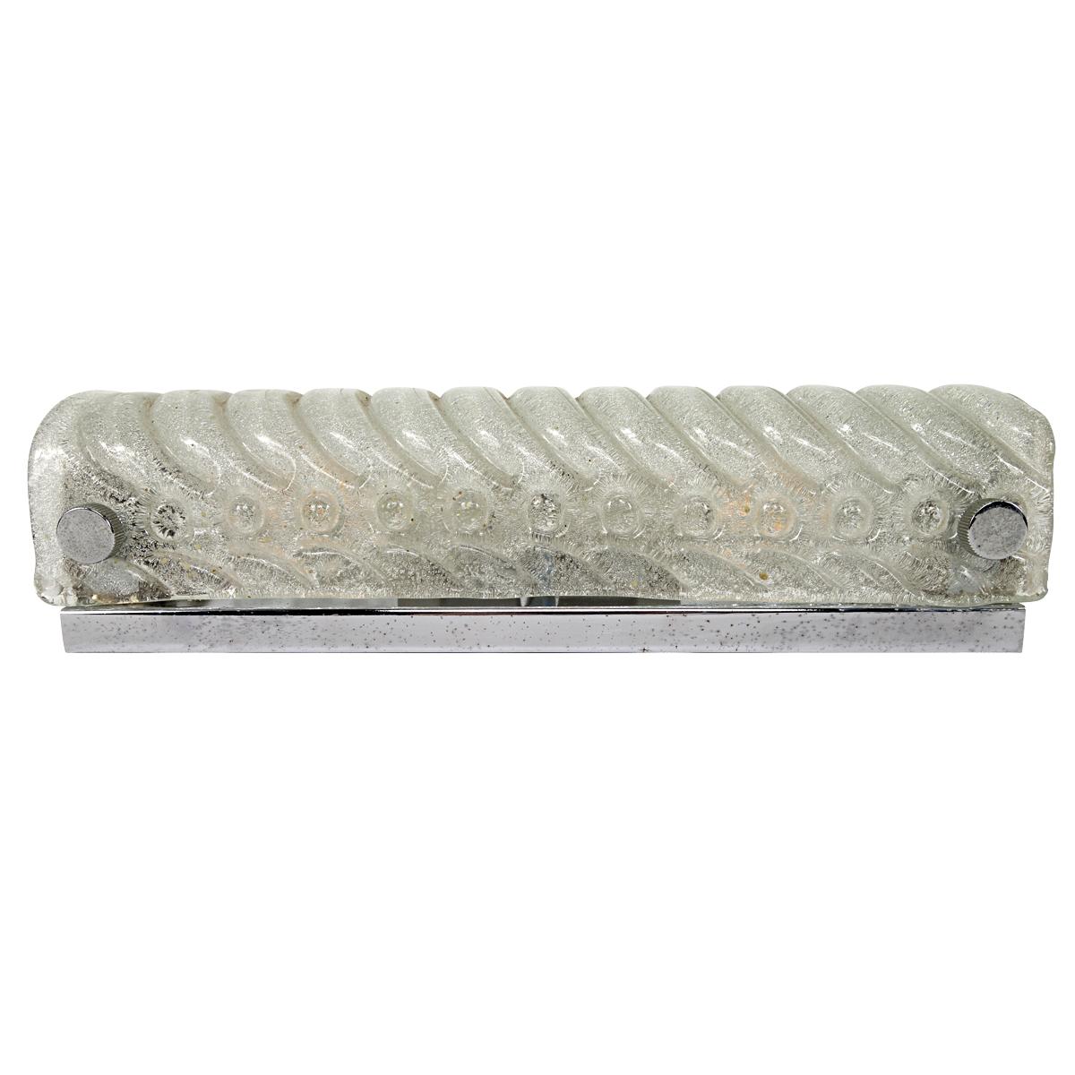 Sophistication pur sang, this sconce or flush mount by Kalmar. 
The wave shaped ice glass is a pleasure for the eye. Moreover the light coming from it really warm.
The fixture has two bulbs and its own light switch.