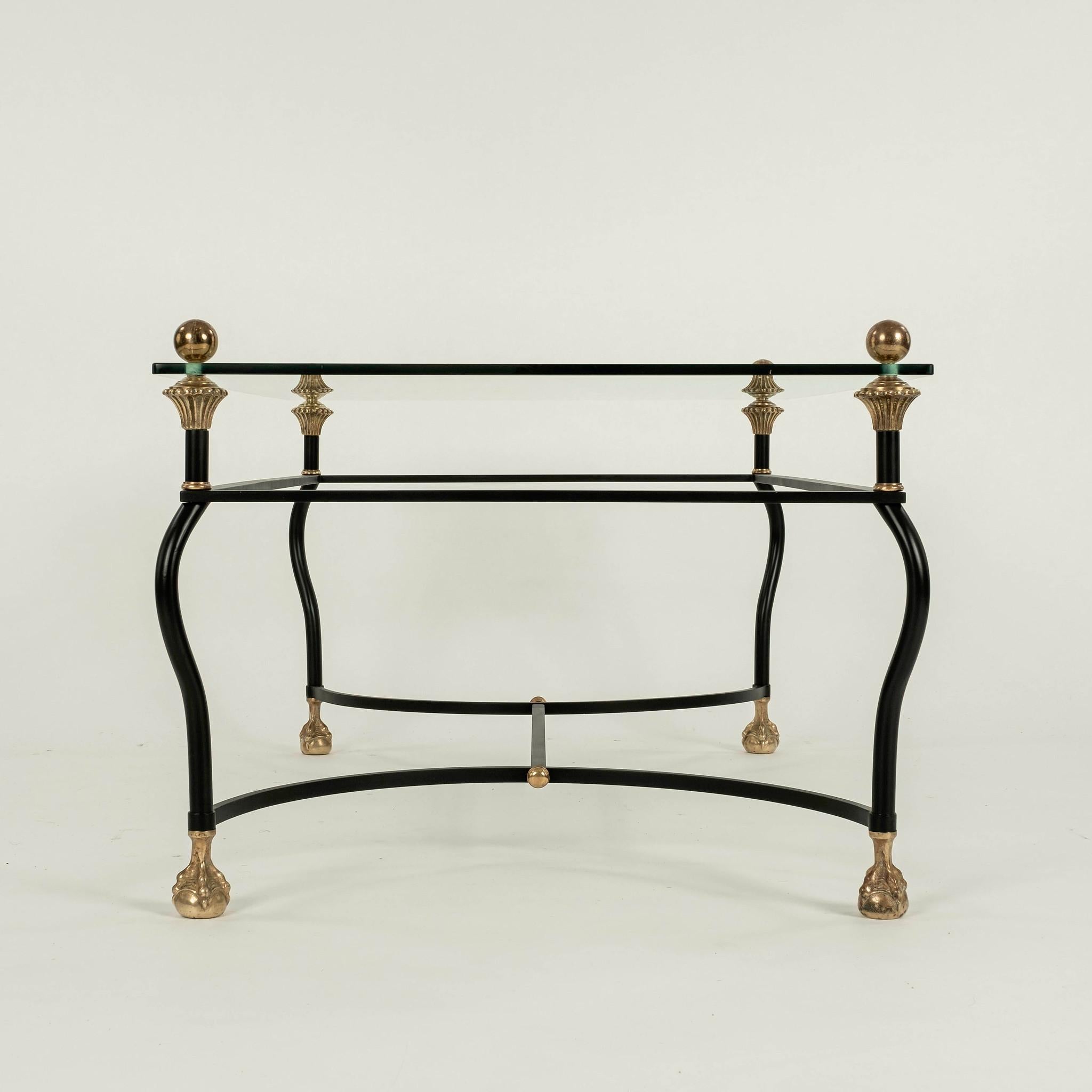Vintage Italian black iron and brass Hollywood Regency cocktail table with glass top.