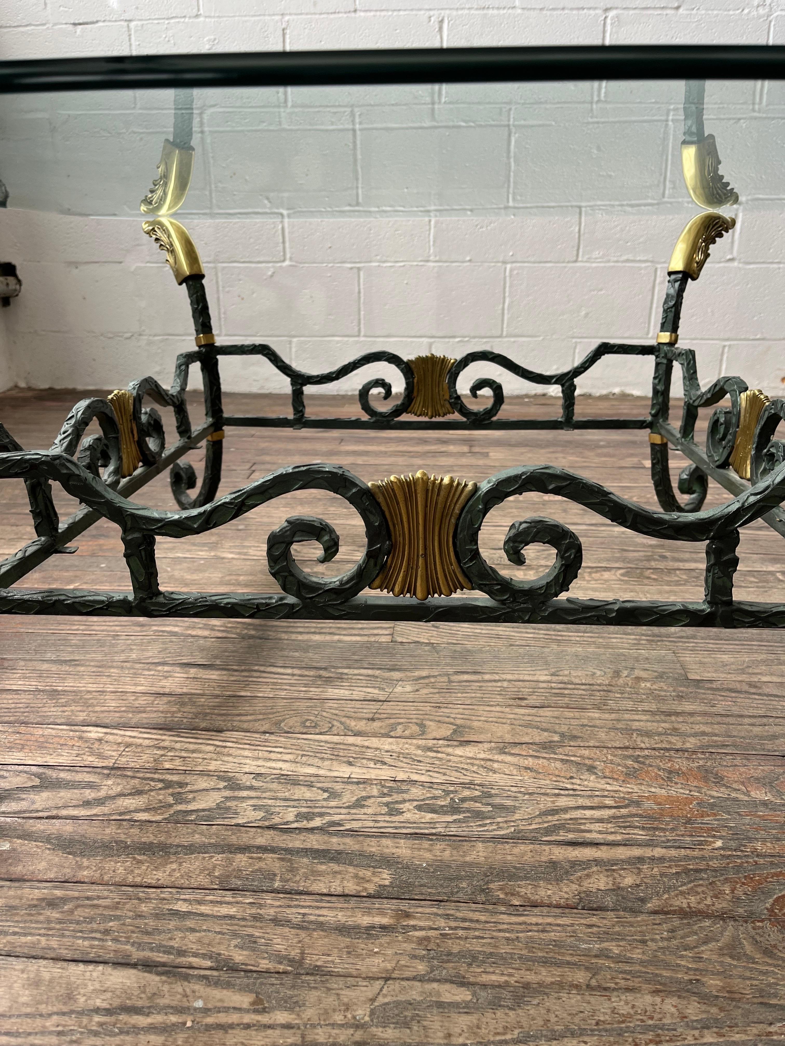 Unique textured wrought iron coffee or cocktail table with beveled glass top. Beautiful brass accents to compliment the textured verdigris wrought iron. 
Curbside to NYC/Philly $350
