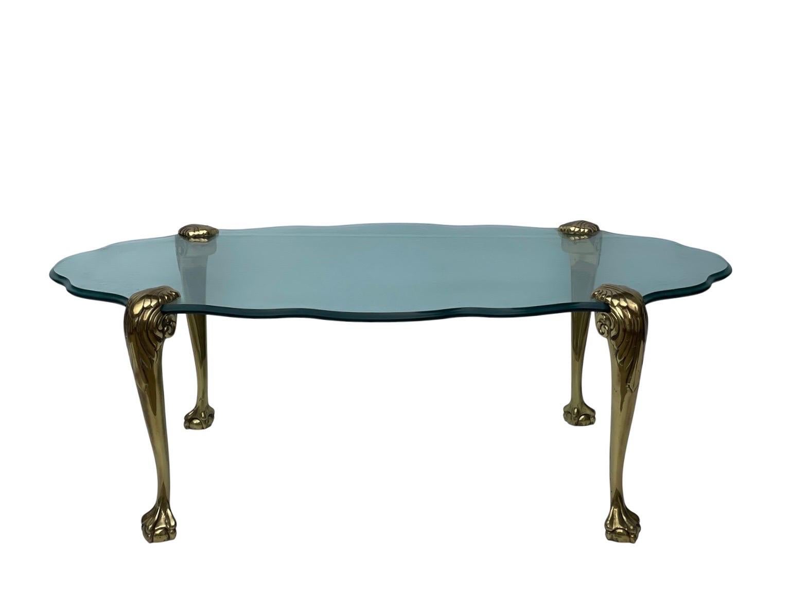 Stunning Italian design beveled glass coffee table with sculpted solid brass claw feet legs.