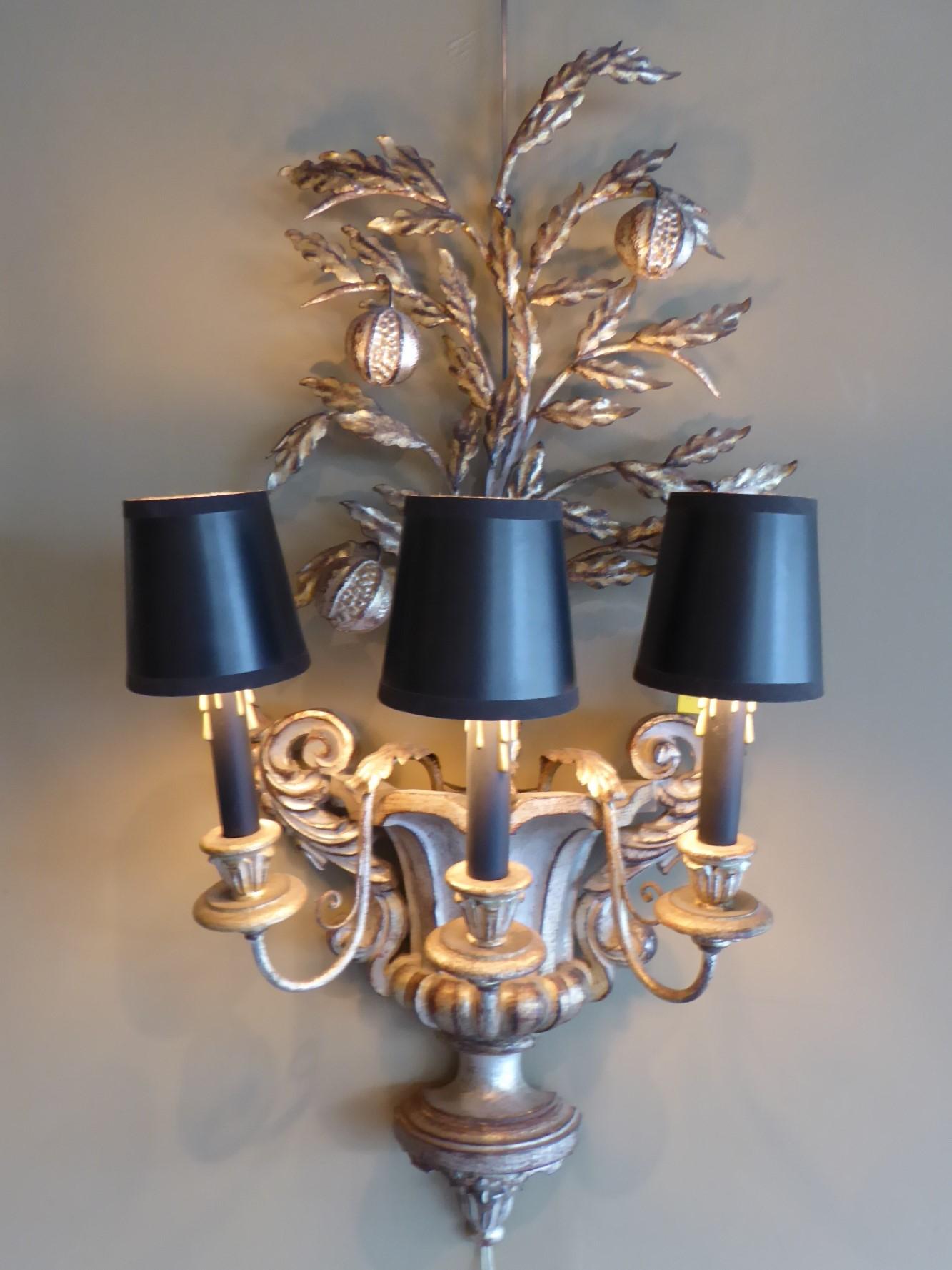 Elegantly representing a large ornate handled urn with a pomegranate topiary growing out of it, this Italian carved & silverleafed applique is just magnificent. A fine metalworked pomegranate topiary tree with fruits rises from the carved urn with
