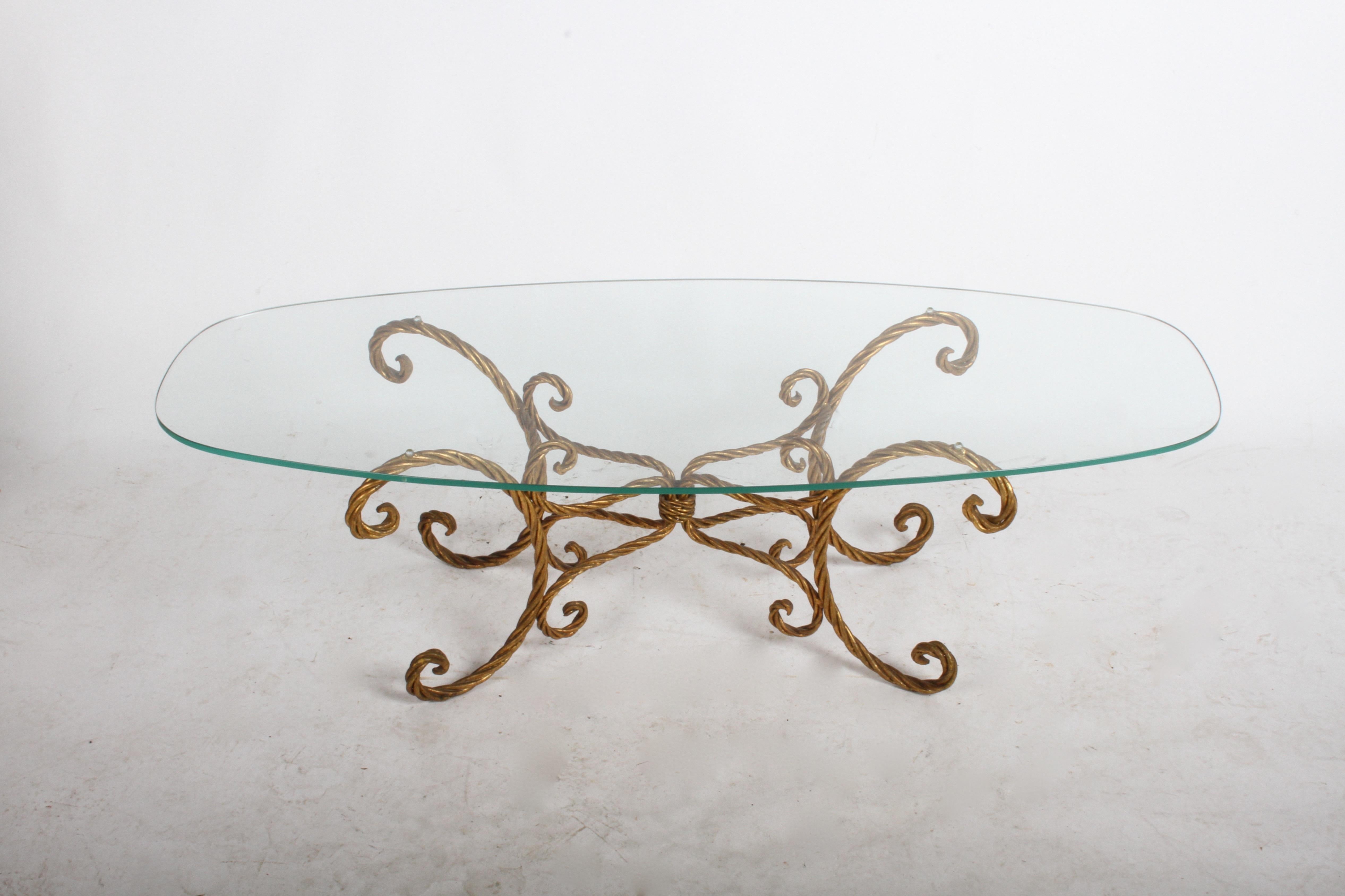 Hollywood Regency or midcentury Italian gilt braided rope coffee table with oval form glass. Original 3/8