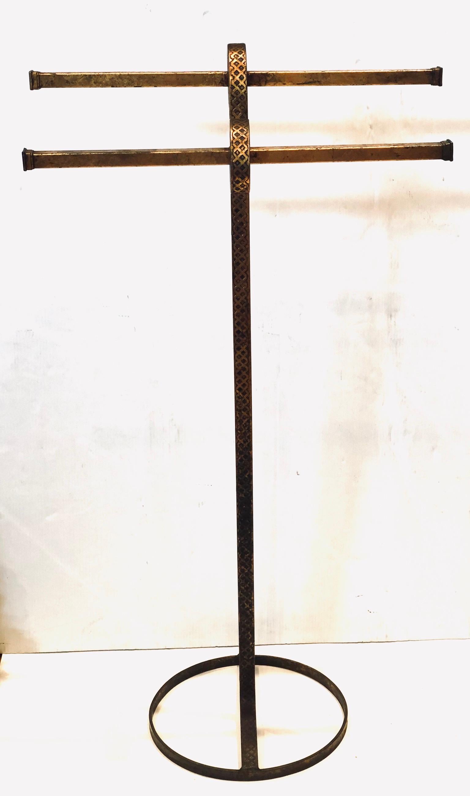 Elegant Italian gold guild towel holder, circa 1950s in original condition with 4 towels poles, hand-hammered iron
Detail well balanced.