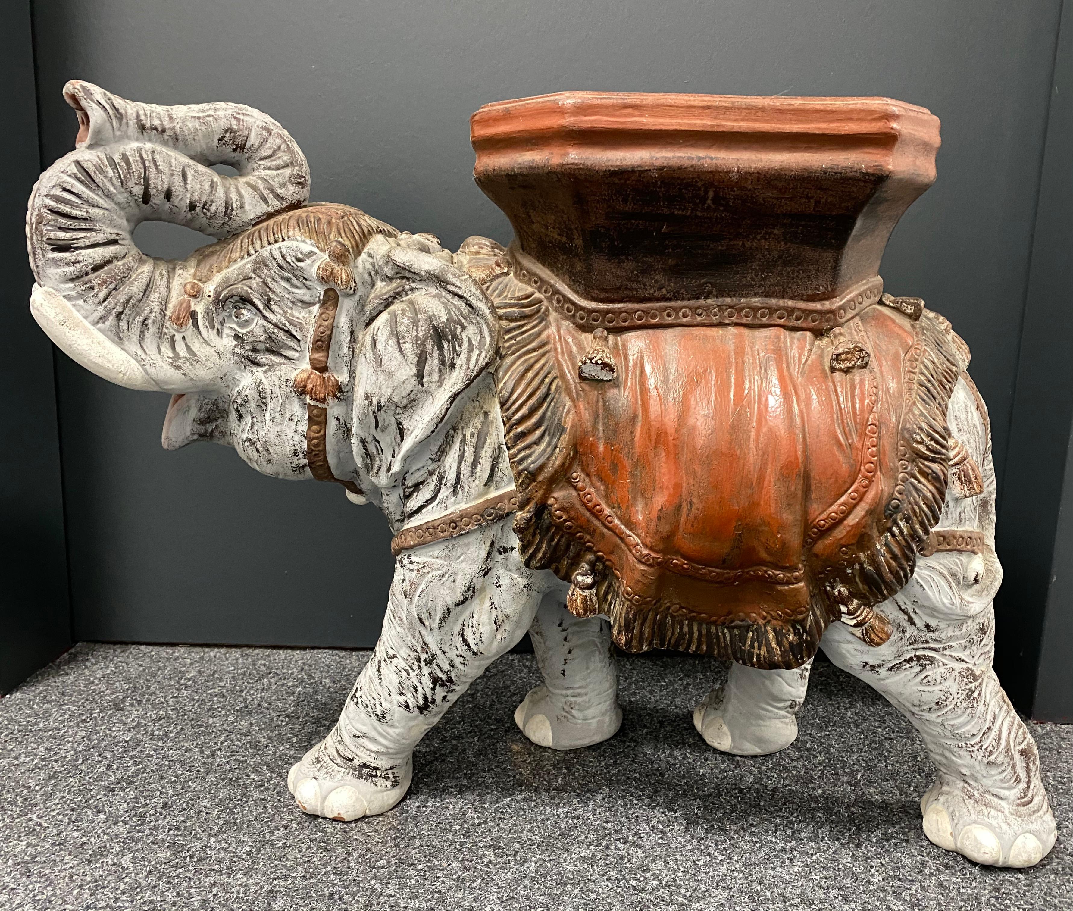 Mid-20th century earthenware terracotta garden stool plant stand or seat, flower pot seat or side table. Handmade of terracotta. Vintage garden seat in the shape of an elephant with a pedestal top, all in grey, white colored with brown and black