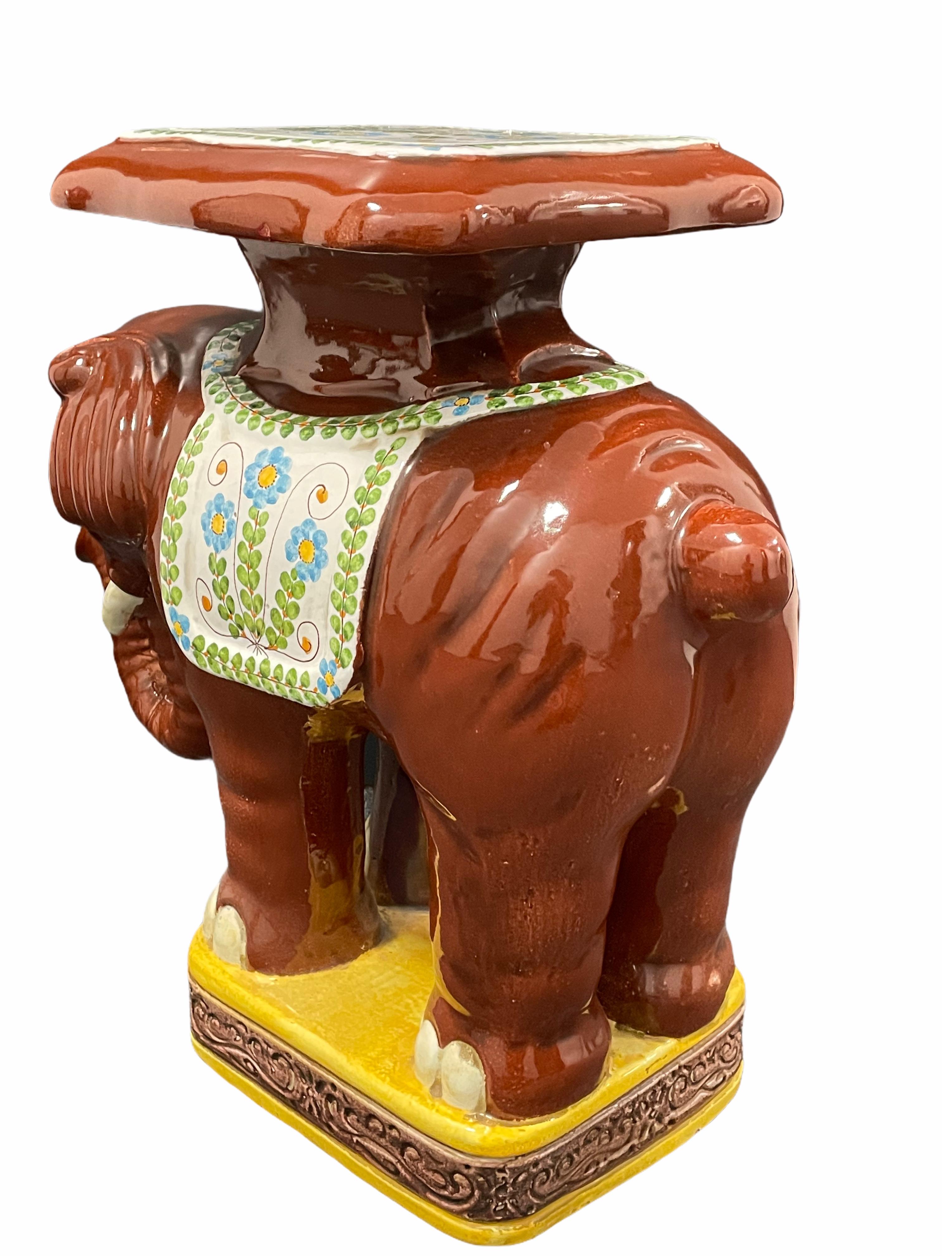 Mid-20th century glazed terracotta garden stool plant stand or seat, flower pot seat or side table. Handmade of terracotta. Vintage garden seat in the shape of an elephant with a pedestal top, all in beautiful color and details. Nice addition to