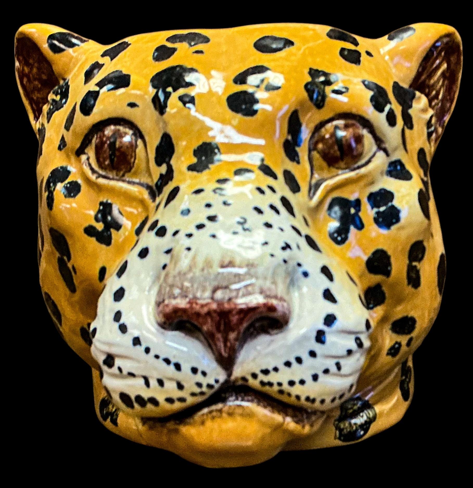 This is a fun Hollywood Regency Italian terracotta leopard bust form planter. The opening is approximately 5.75” inches diameter. It is in very good condition.