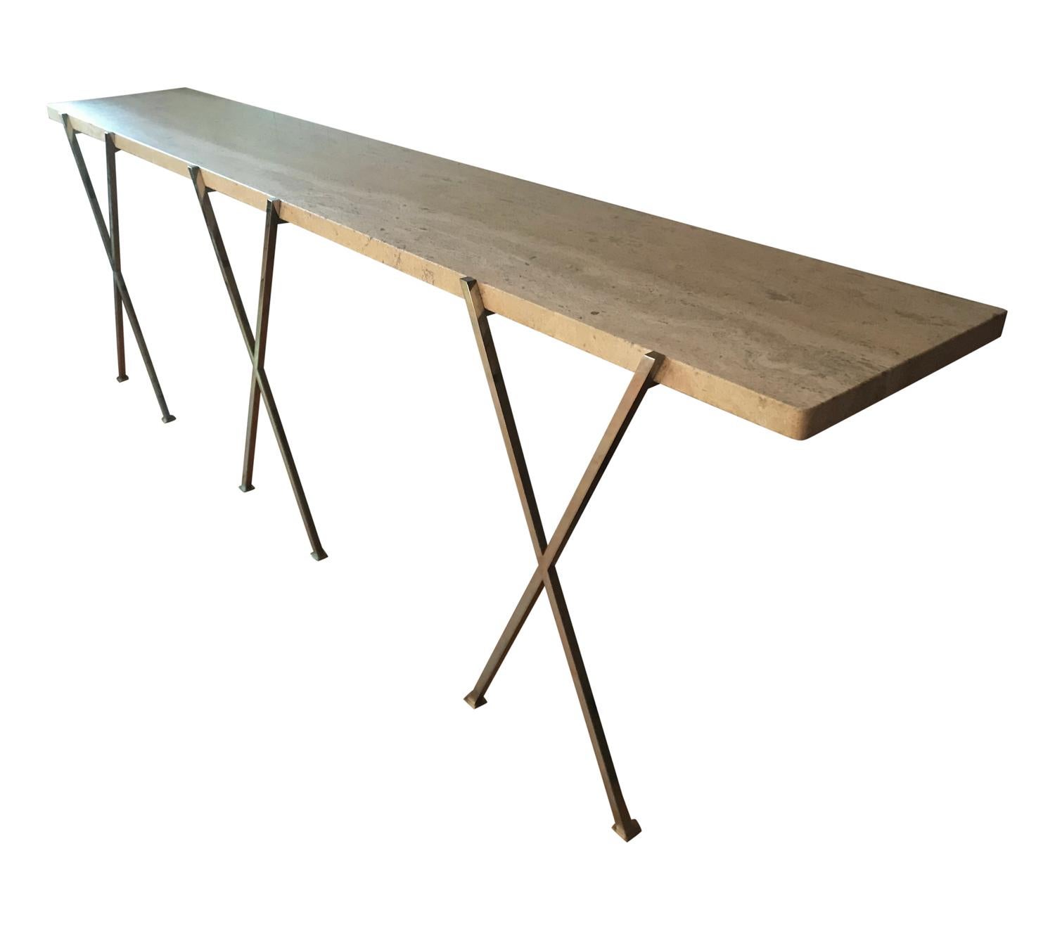 An extra-long and monumental floating console table or hallway table. This very impressive piece consists of polished steel X-braces with a thick long piece of travertine. In perfect vintage condition.